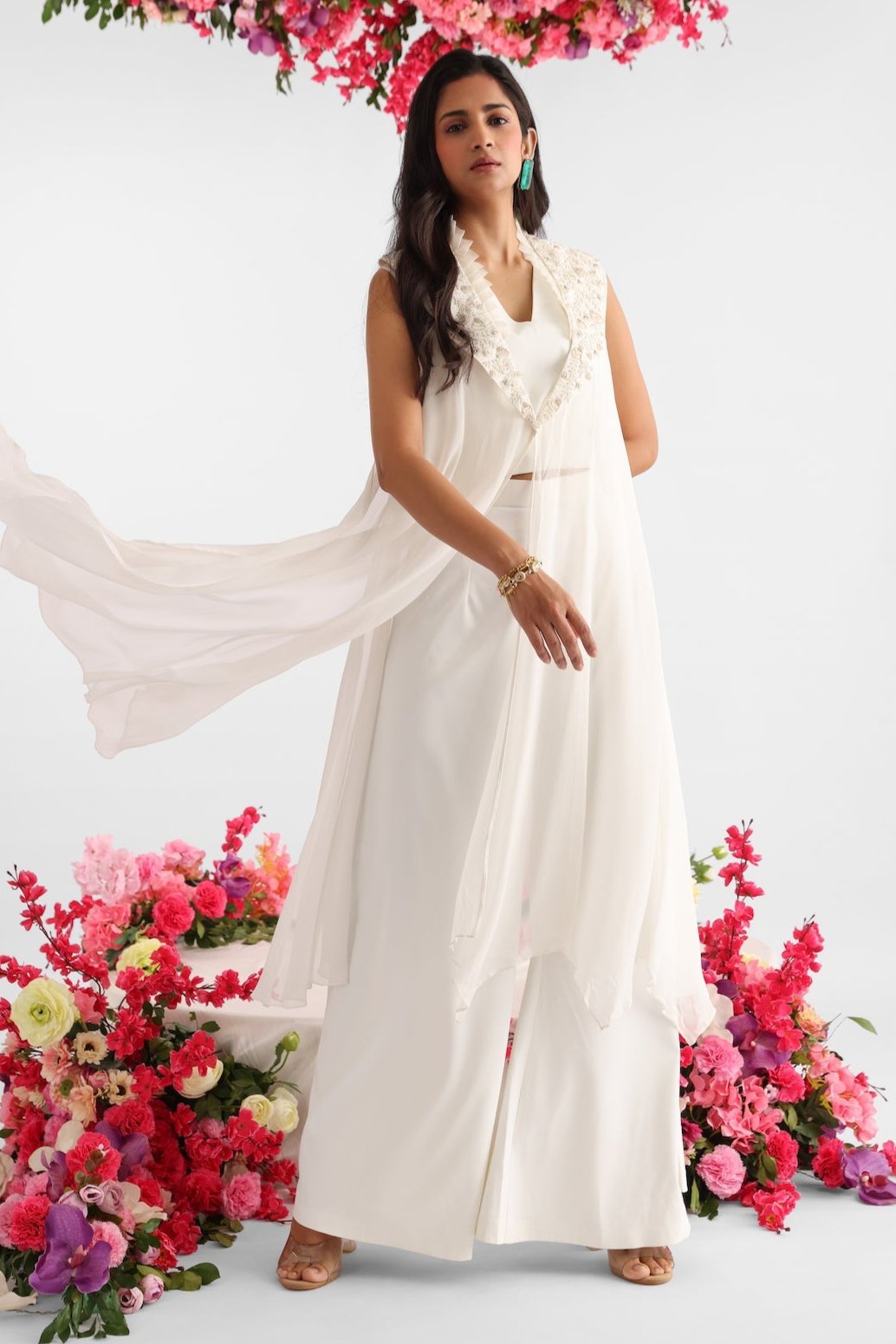 White georgette cape with 3D floral details and pearl embroidery paired with white crop top and flared pants – Golden Muslin