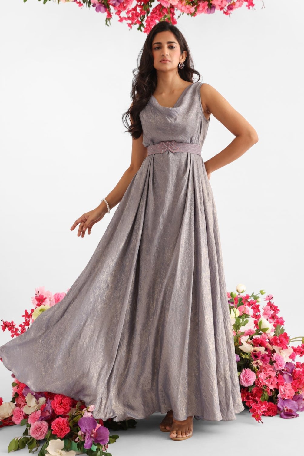 Grey gown with gold foil finish, cowl neckline, and signature Golden Muslin logo belt