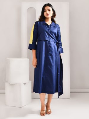 “Golden Muslin deep blue blended cotton dress with overlay wrap jacket design and quirky embroidery detailing.”