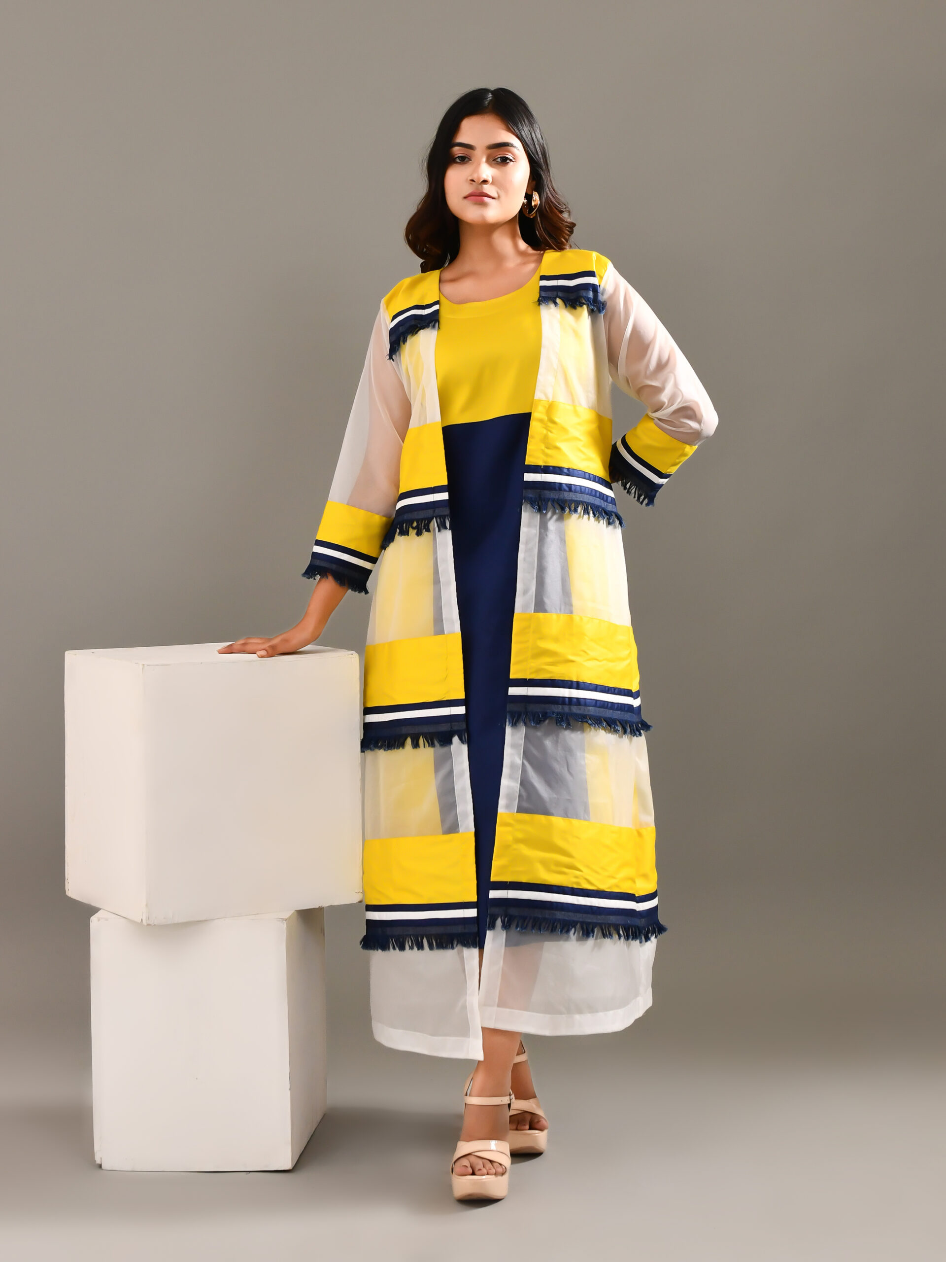 “Golden Muslin multicolored two-piece cotton and organza dress with layered stripe-detail overlay jacket and lightweight textured design.”