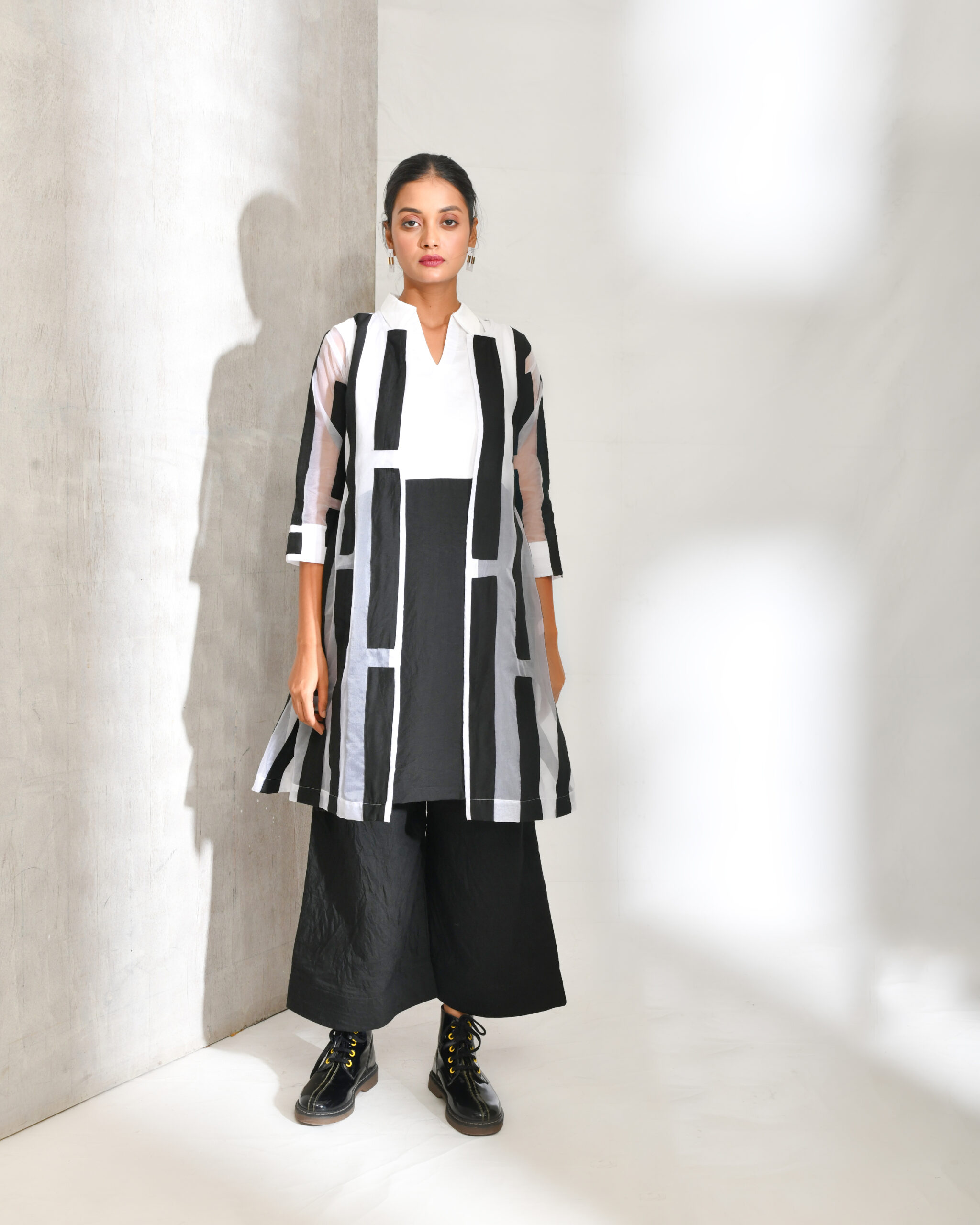 “Golden Muslin black and white colour-blocked cotton co-ord set with collared top and organza patchwork jacket featuring modern contrast detailing.”