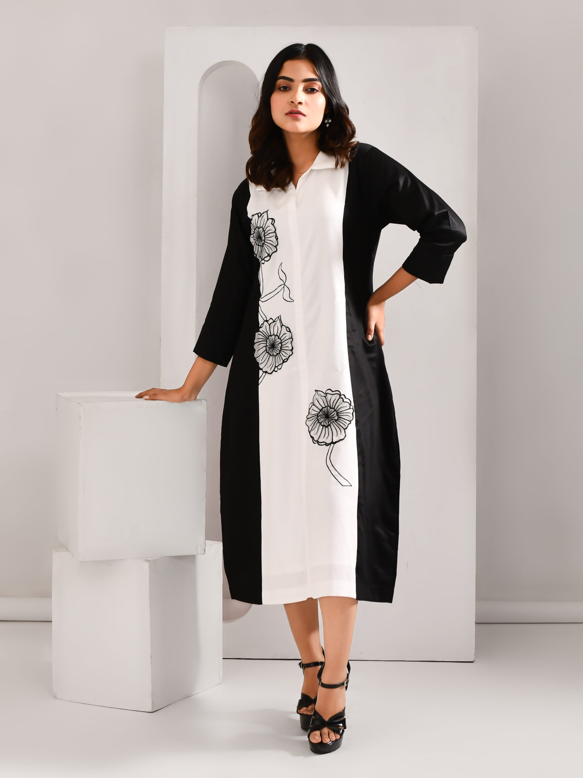 “Golden Muslin black and white blended cotton dress with intricate embroidered organza patch detailing.”