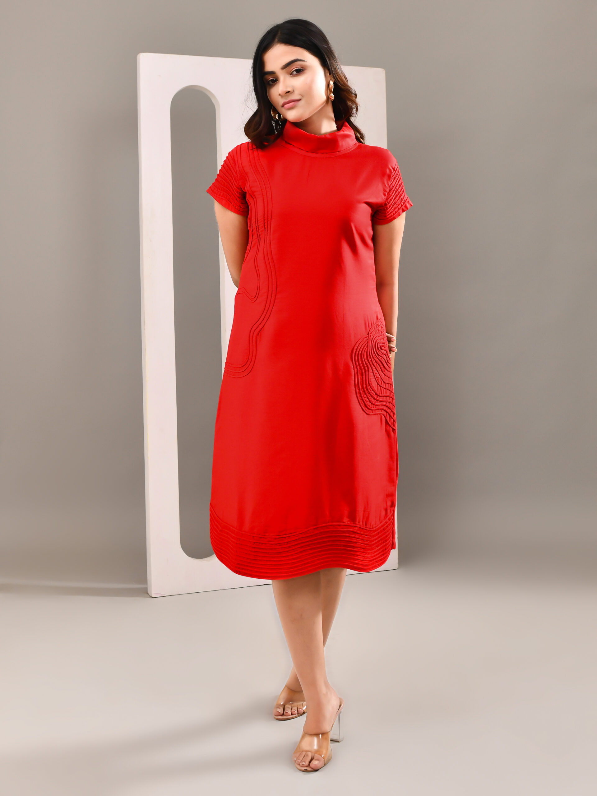 “Golden Muslin cherry red blended cotton dress with tone-on-tone rippled wave detailing for depth and sophistication.”
