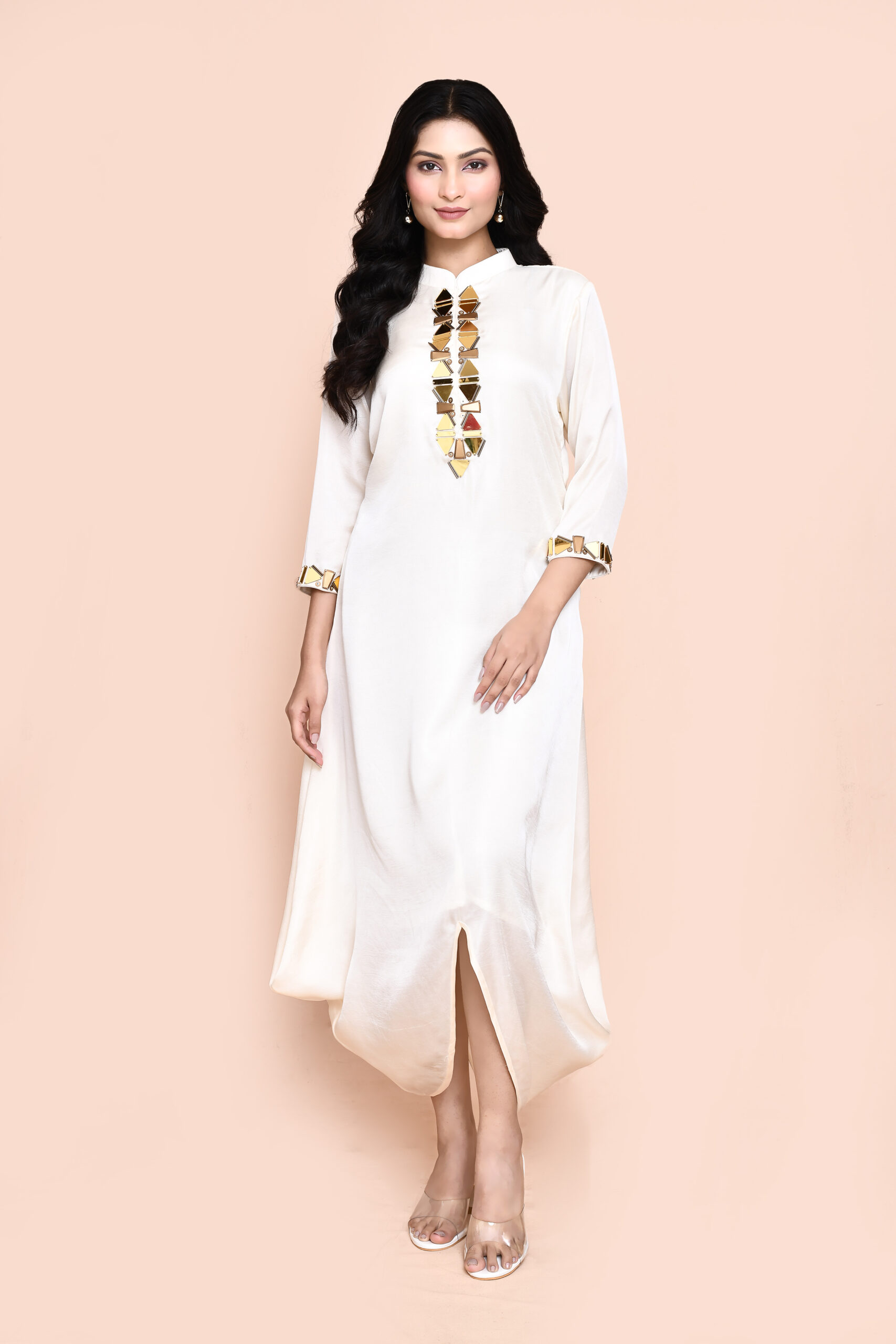 Golden Muslin Jaanvi Mohta ivory silk blend draped tunic with gold embellishments on the neckline and sleeve hem