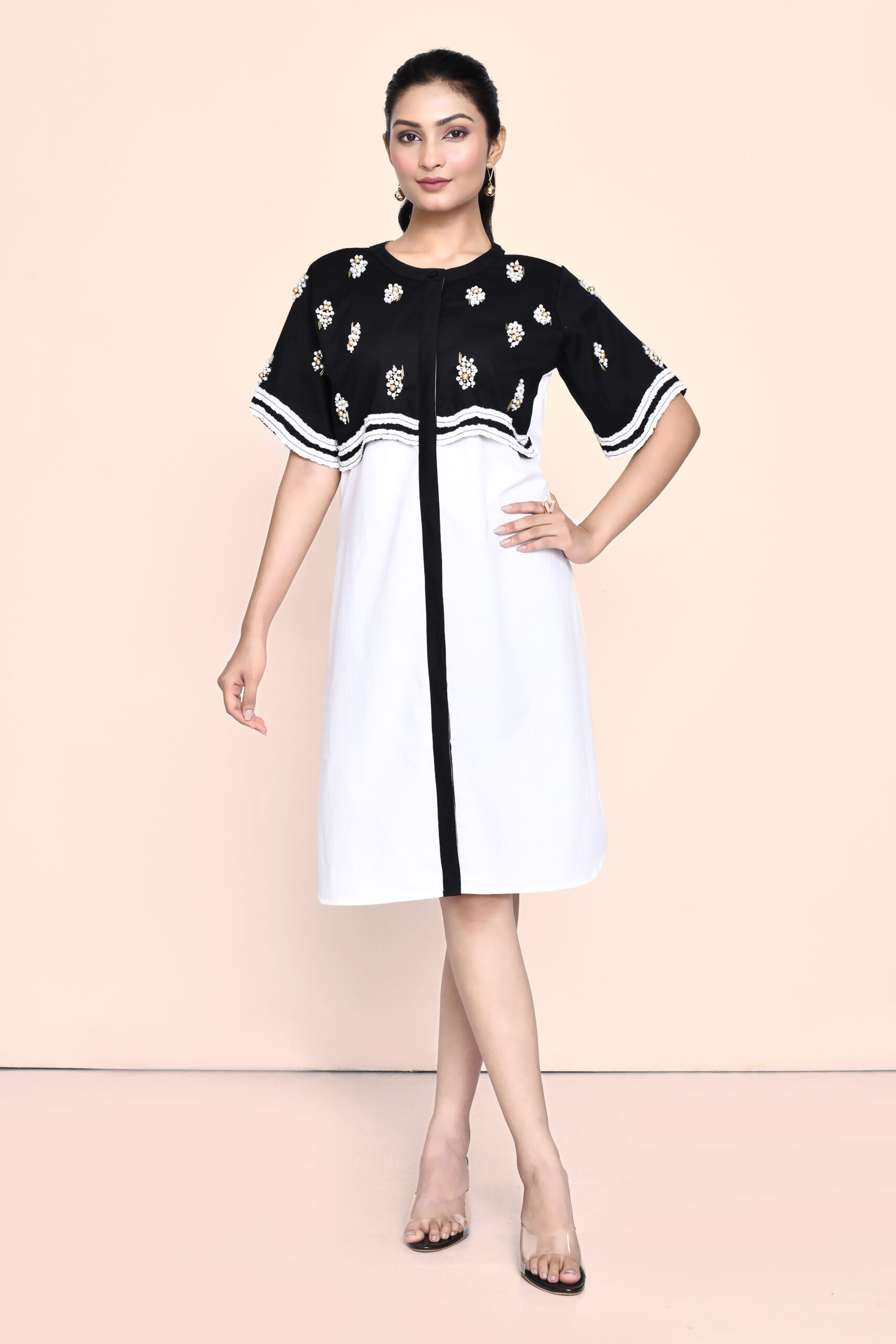 Golden Muslin Jaanvi Mohta black and white color-blocked poplin dress with stylized sleeves, fabric ruching, and pearl embellishments