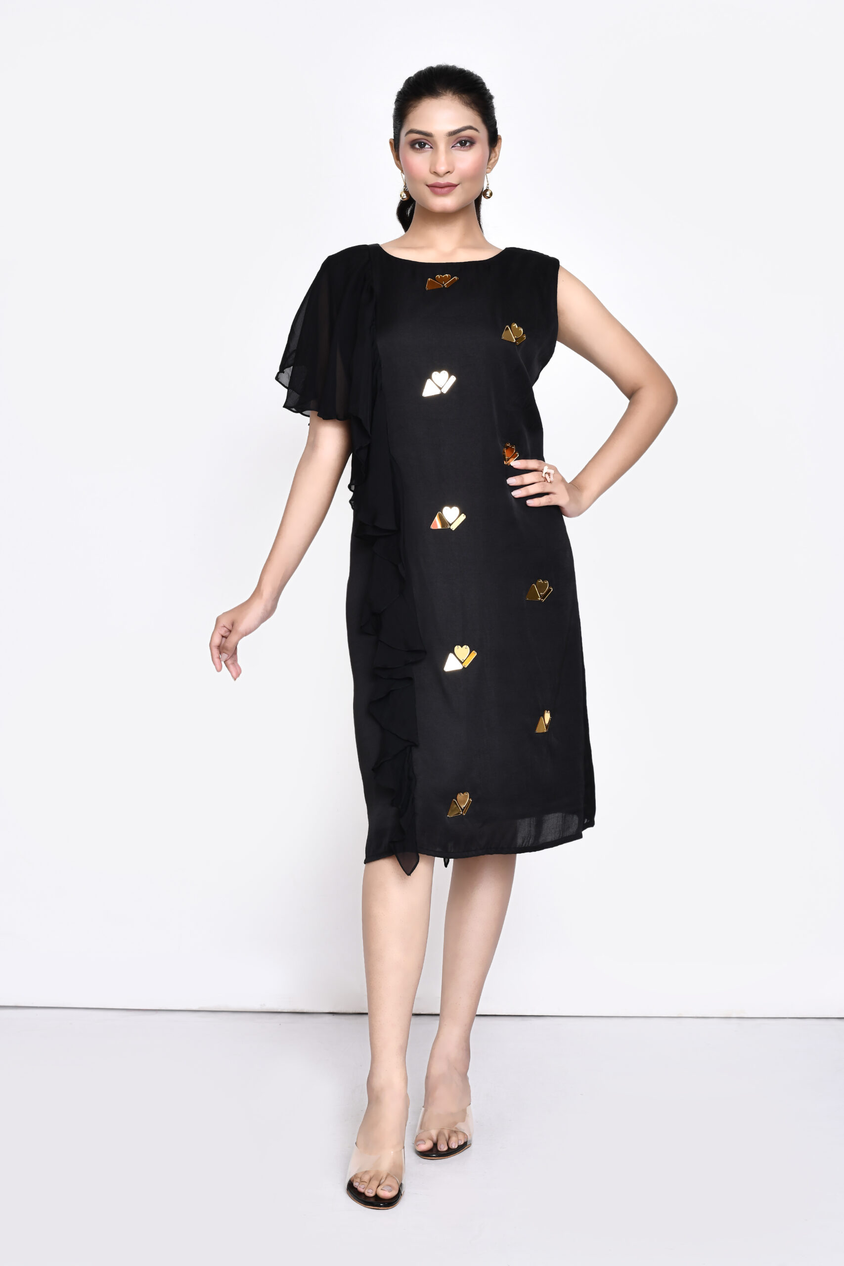 Golden Muslin Jaanvi Mohta black silk blend shift dress with organza ruffles and chunky gold embellishments
