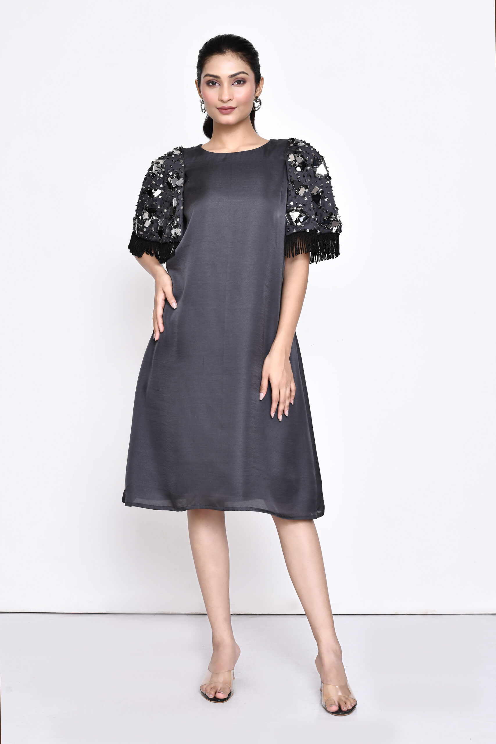 Golden Muslin grey silk blend shift dress with cape sleeves, chunky hand embellishments, and delicate fringes