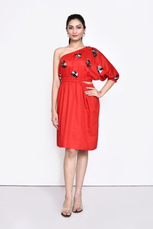 Golden Muslin Jaanvi Mohta red cotton satin one-shoulder dress with chunky embellishments and cut-out elasticated waist