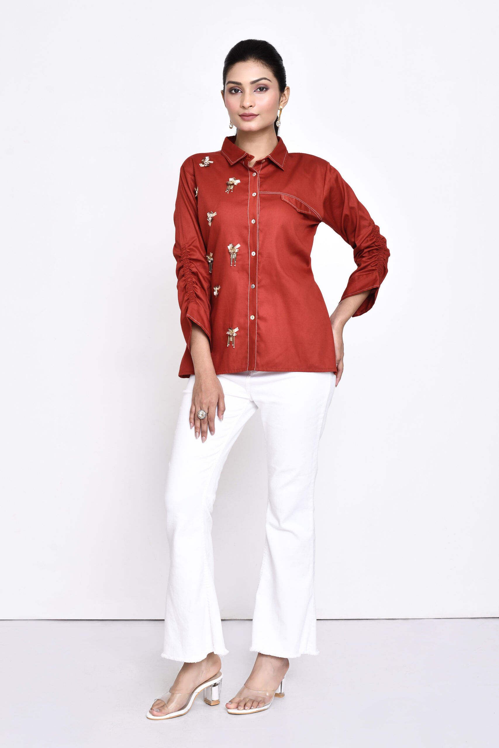 Golden Muslin rust cotton embellished shirt with flap pocket and ruched three-quarter sleeves