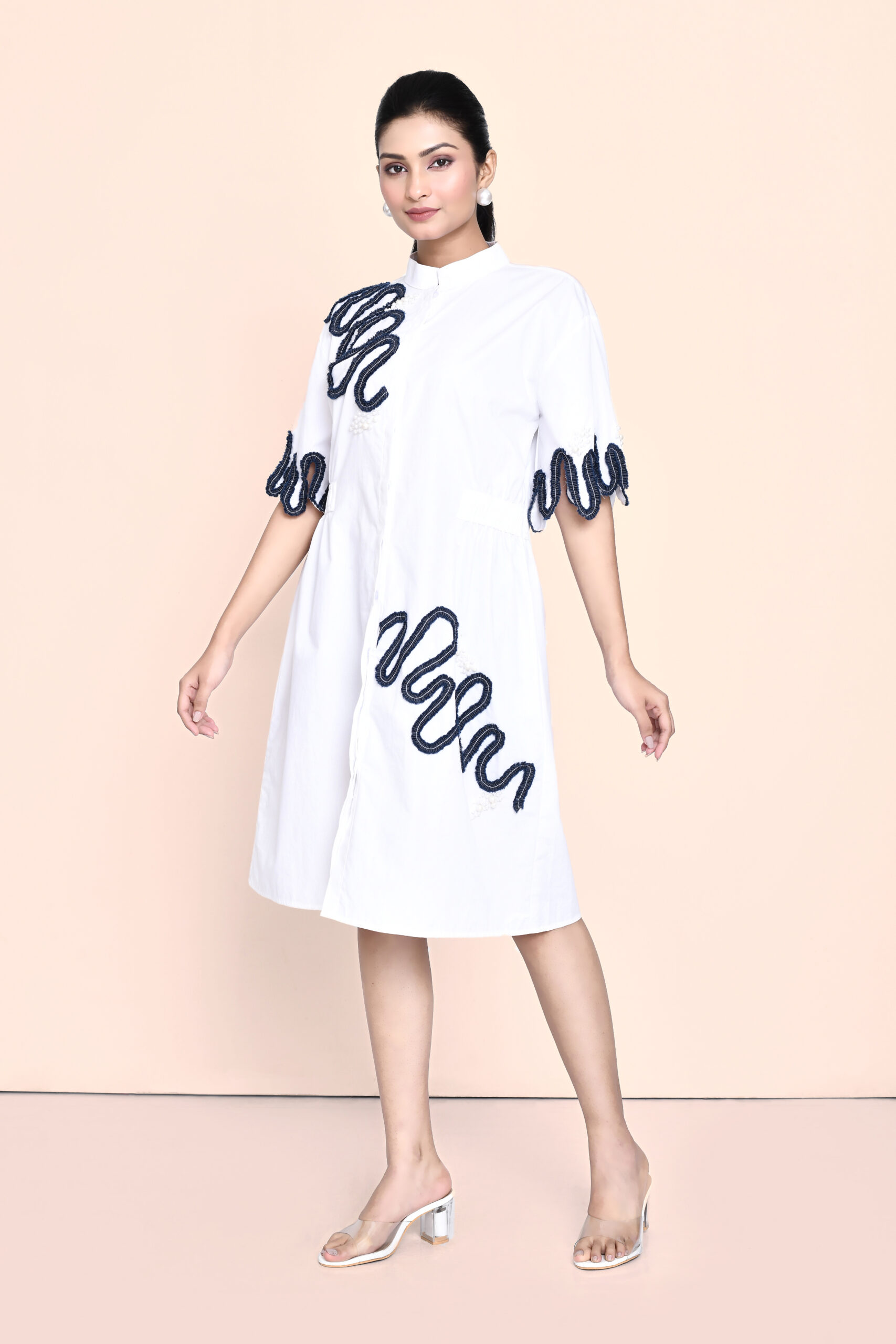 Golden Muslin white cotton dress with denim and pearl embellishments, featuring an elegant contemporary design