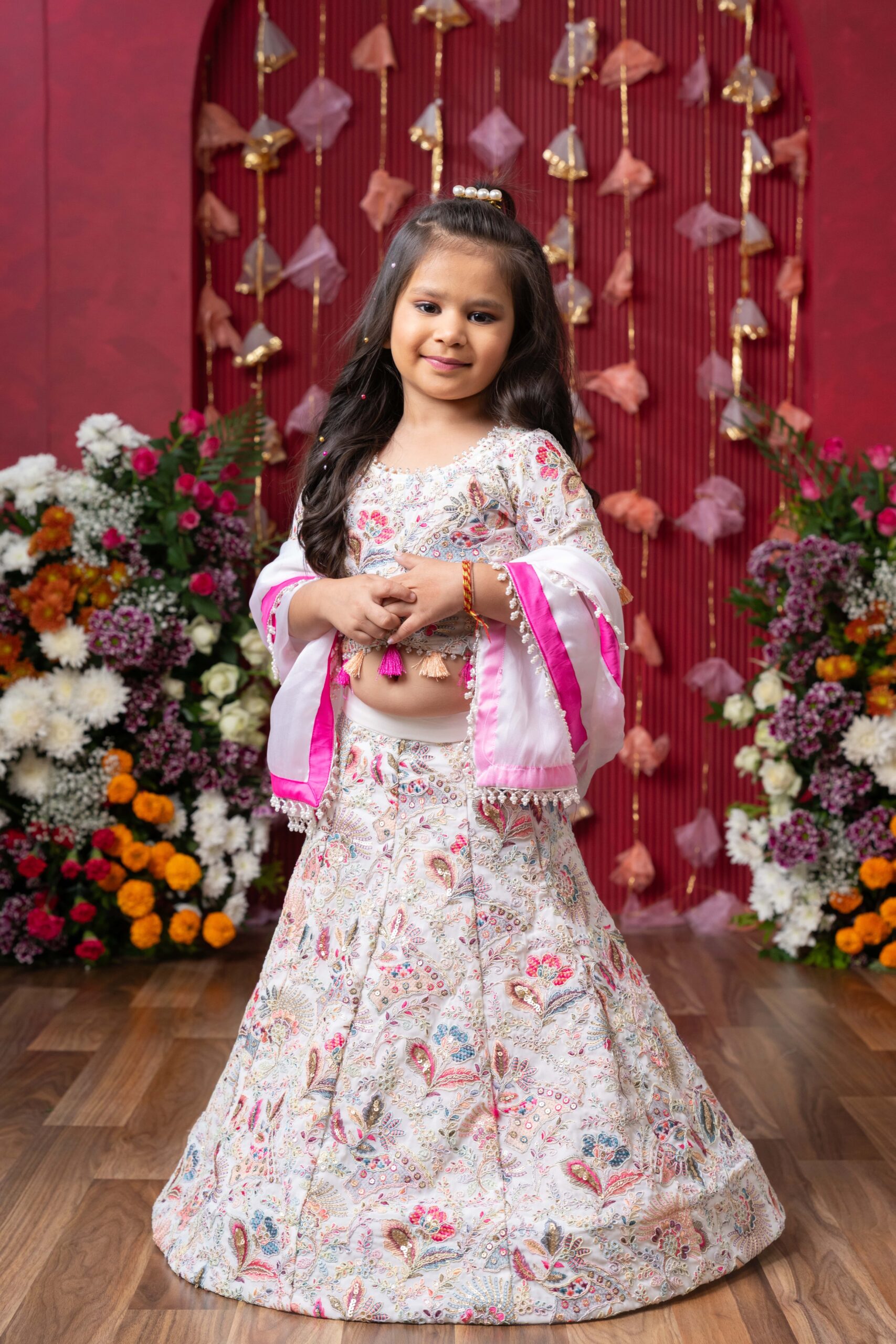 Pastel embroidered lehenga set with paisley–floral motifs, full-sleeved embroidered blouse, and white dupatta with pink border and pearl lace – Golden Muslin