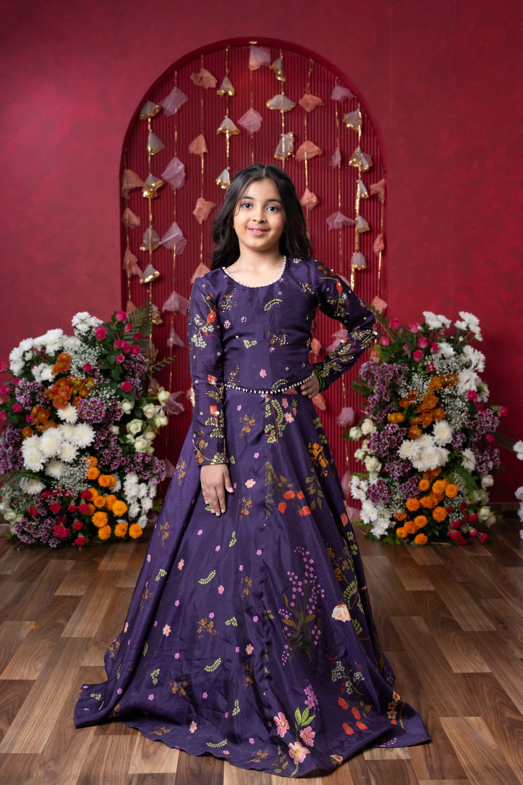 Purple floral-printed peplum top with pearl-embellished neckline and matching flared lehenga – Golden Muslin