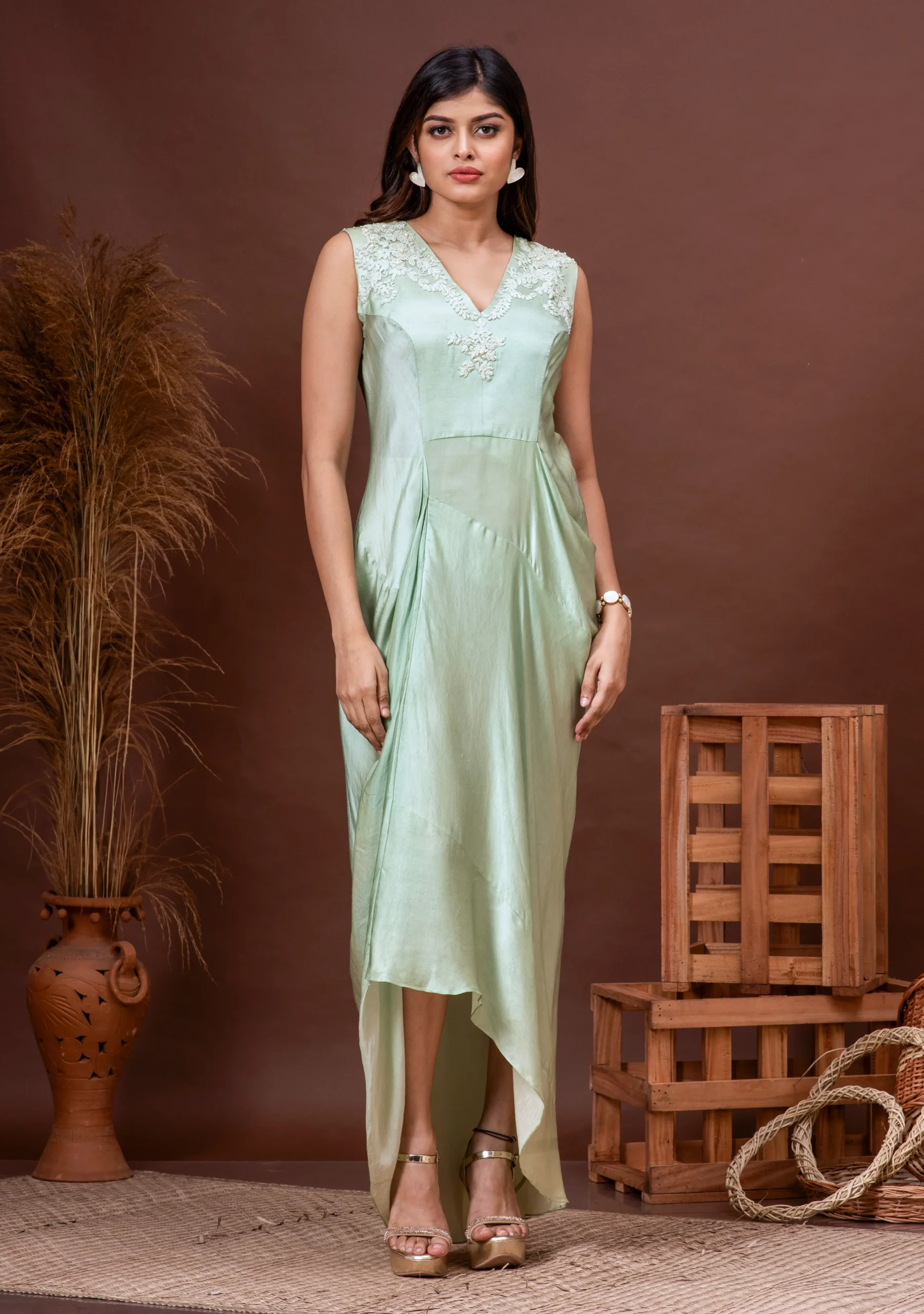 Sleeveless pale green modal satin cowl dress with yoke embroidery By Kumar Rahul from the house of Golden Muslin.