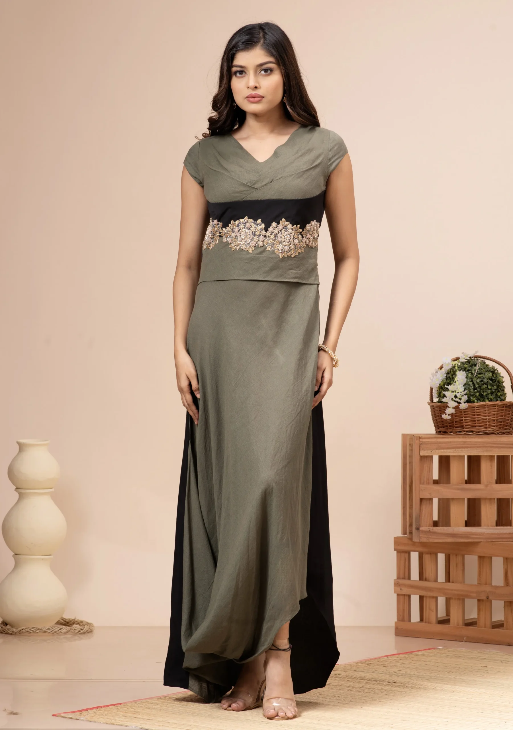 Olive green linen cotton pleated cowl gown with waist embroidery By Kumar Rahul from the house of Golden Muslin.
