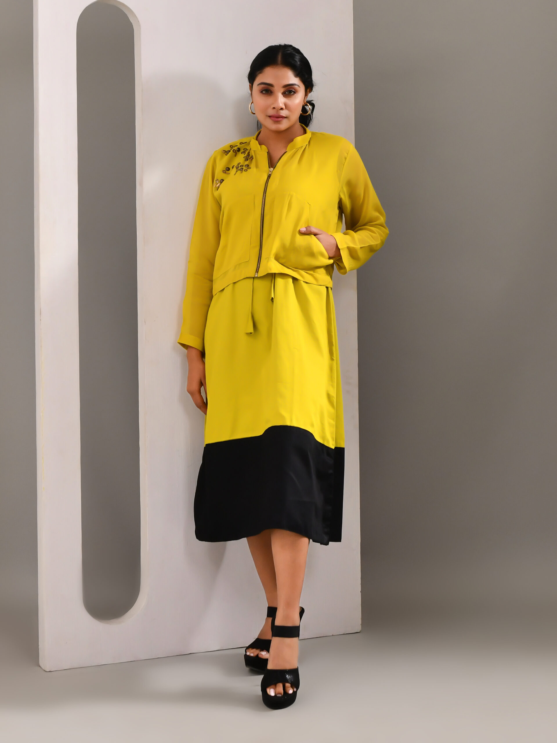 “Golden Muslin deep lime green blended cotton and organza co-ord set with hand-beaded jacket featuring contrasting shoulder embroidery, zip closure, side pockets, and color-blocked dress.”