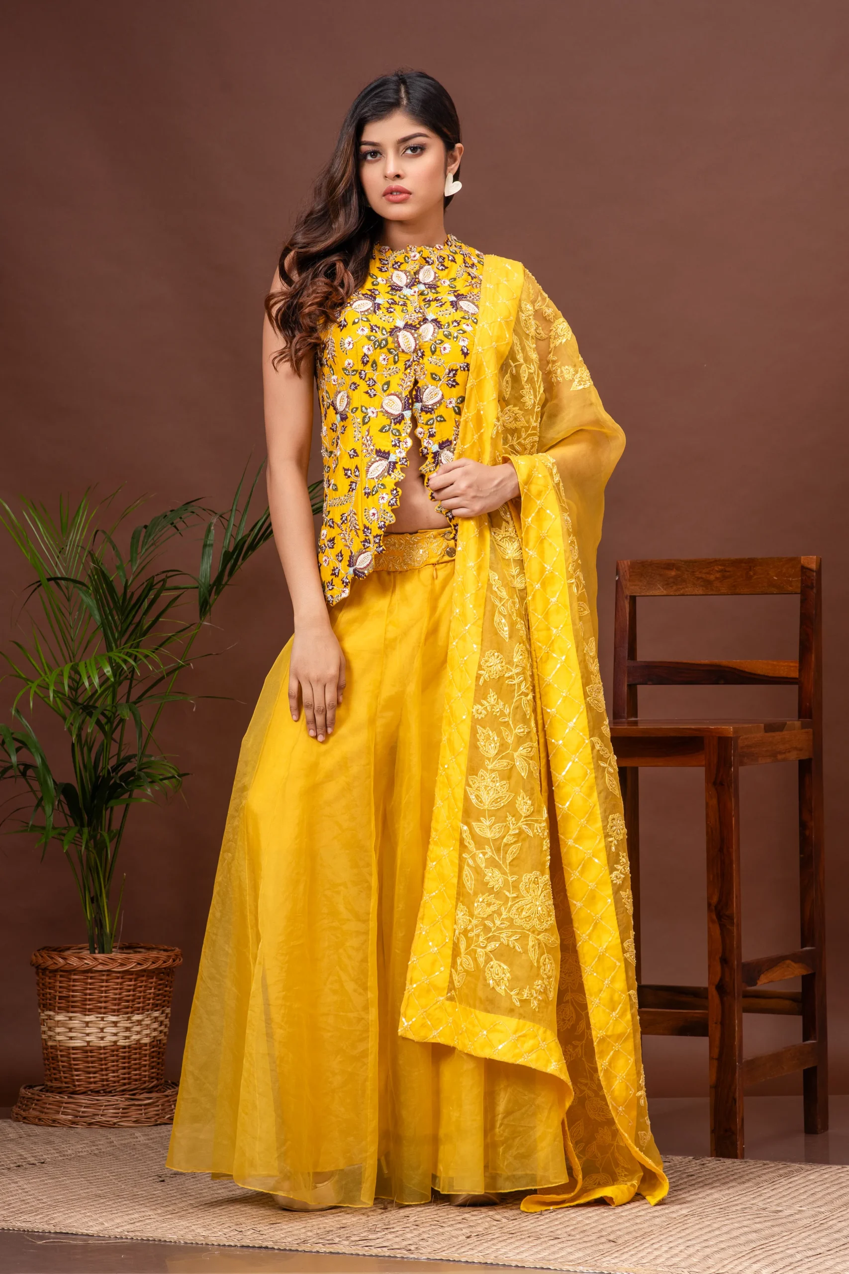 Yellow embroidered Bamberg silk jacket with organza sharara by Satya JB from the house of Golden Muslin.