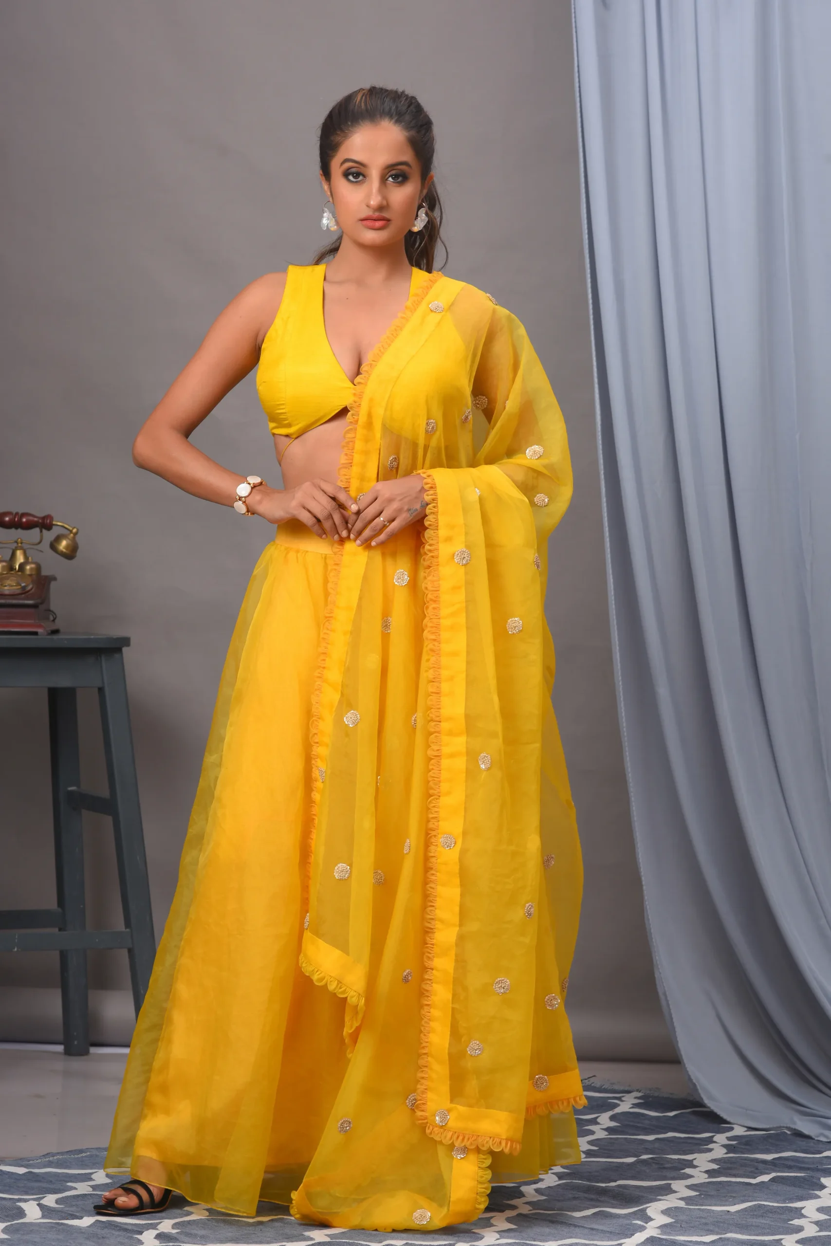 Woman in a yellow Bemberg silk blouse and organza sharara by Satya JB from the house of Golden Muslin.