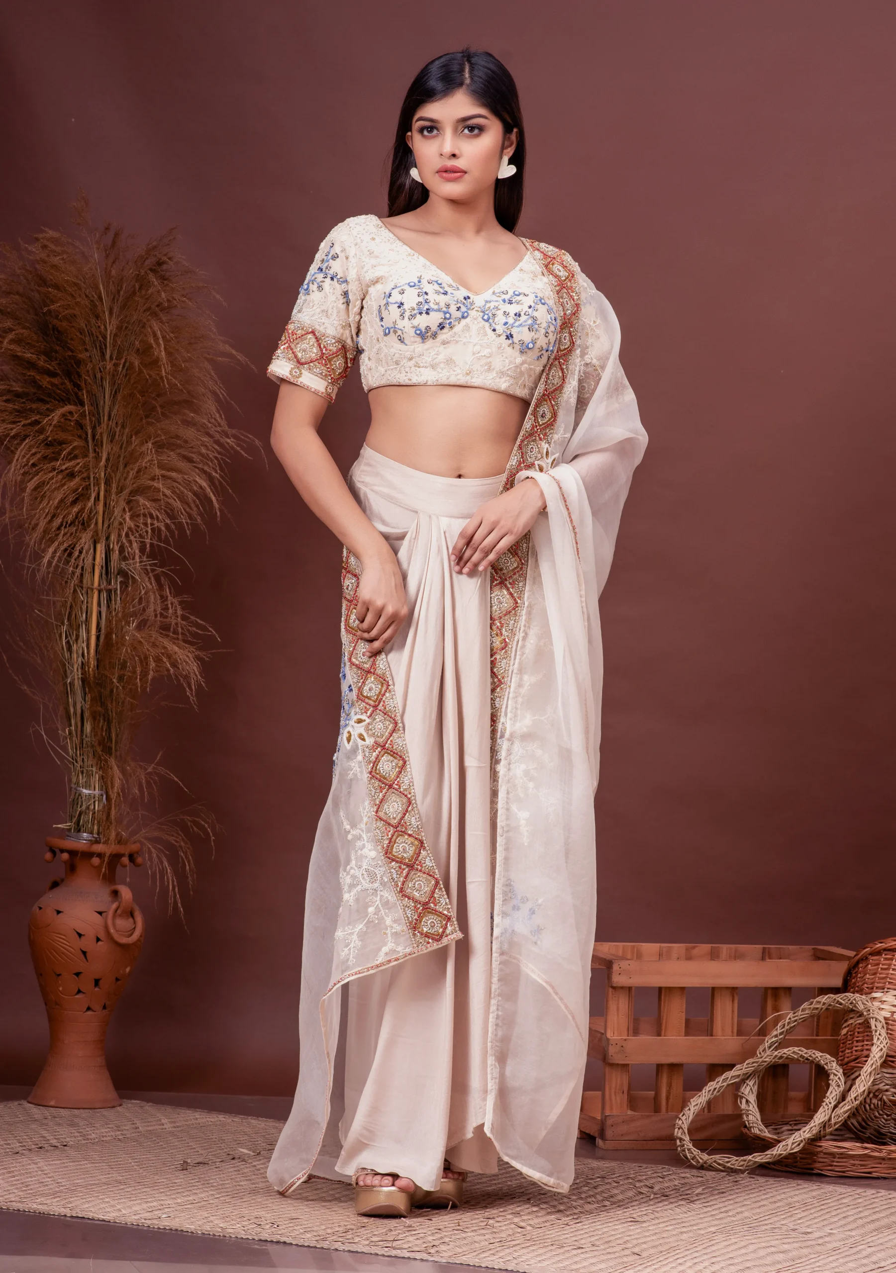 Beige modal satin draped skirt and embroidered silk blouse from the house of Golden Muslin by Satya JB.