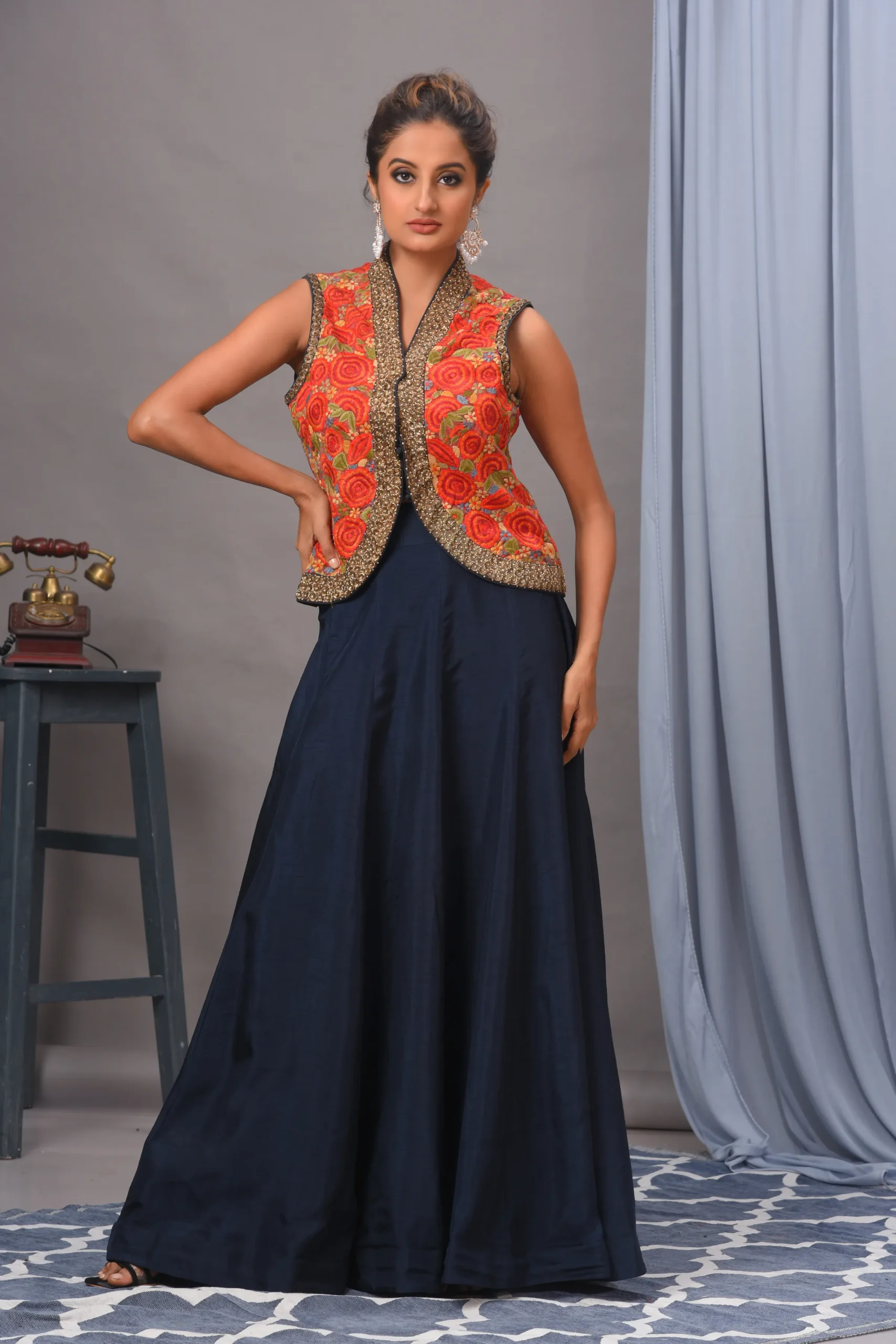 Red Bamberg silk jacket with heavy thread work and navy silk skirt by Satya JB from the house of Golden Muslin.