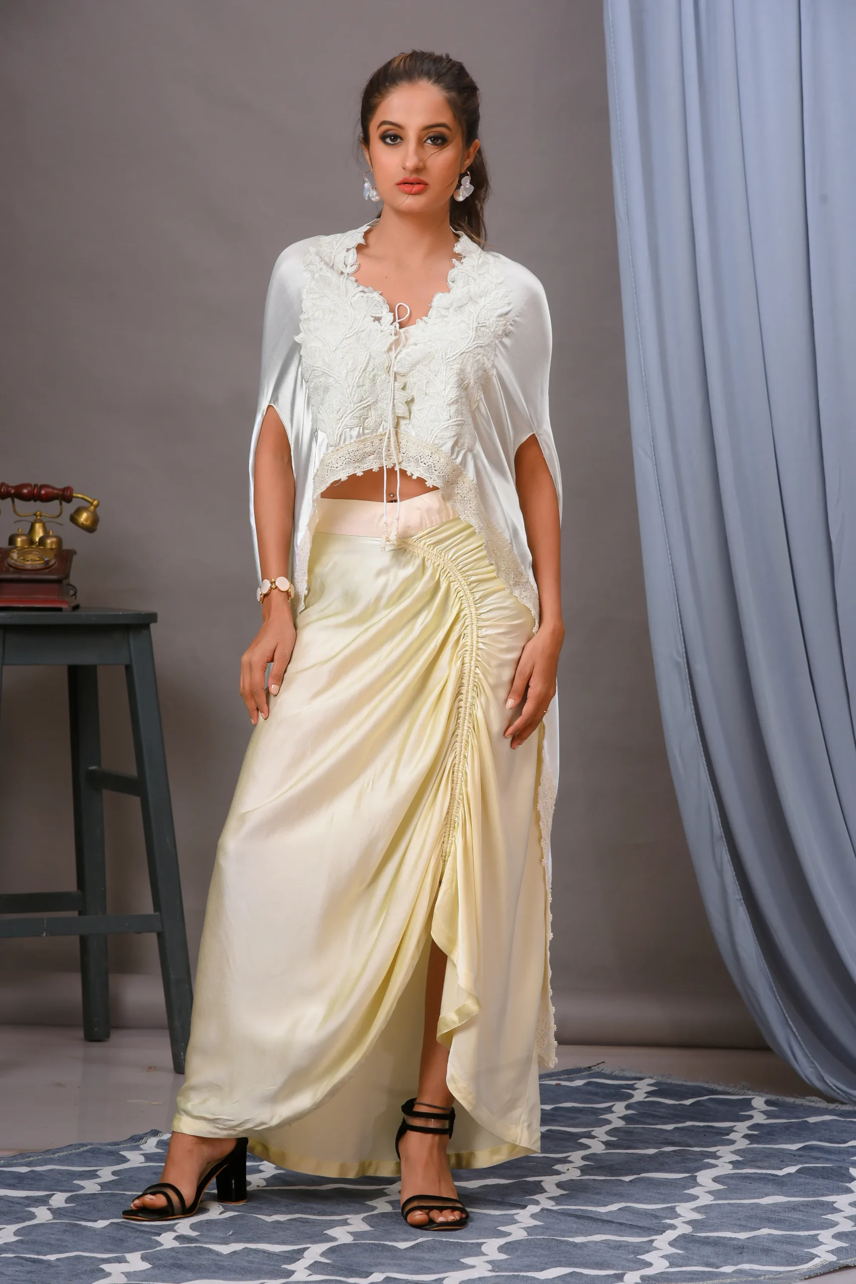 Ivory floral thread work cape and ruched skirt From the house of Golden Muslin By Satya JB with a lycra bustier.