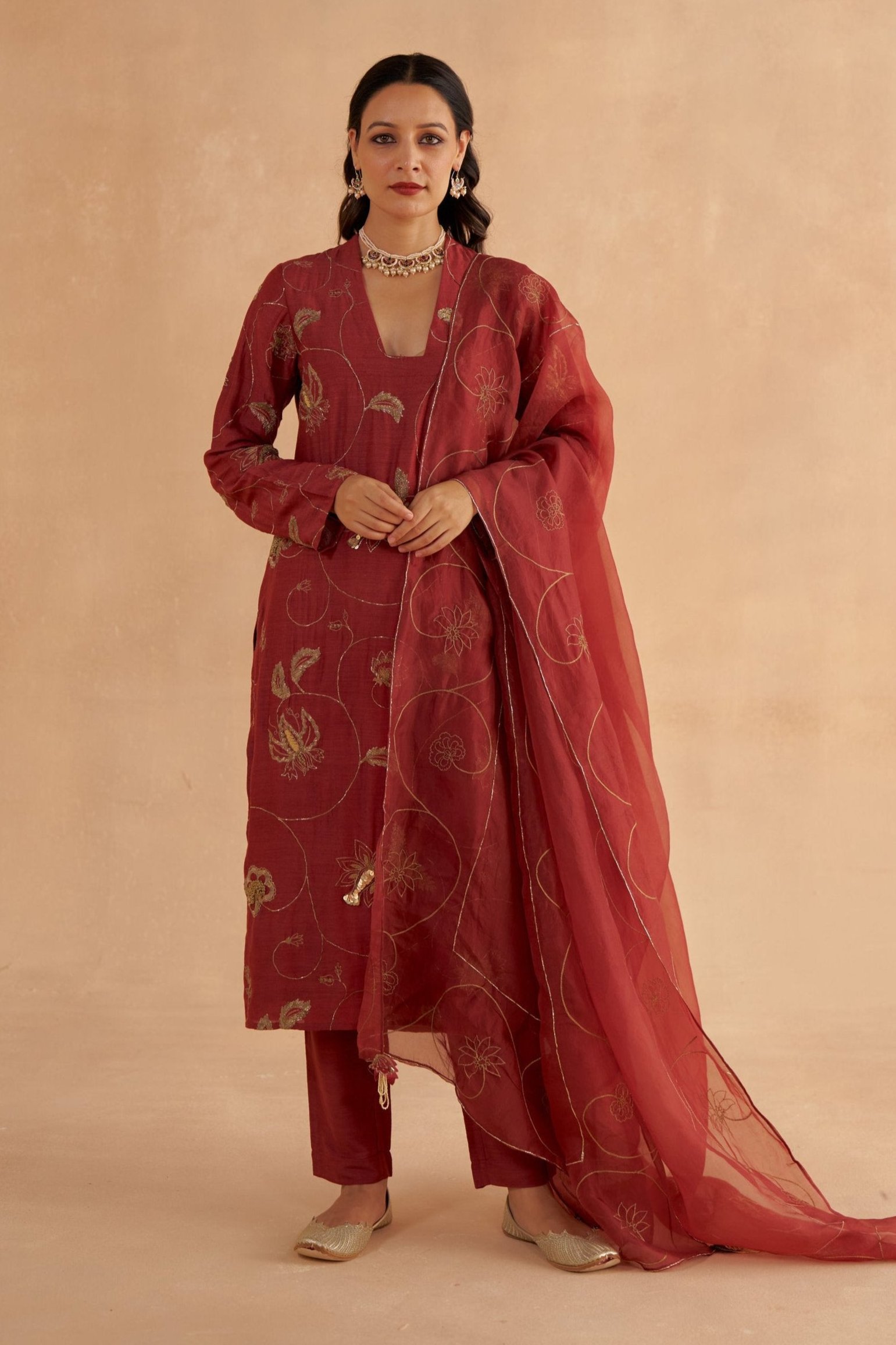Golden Muslin mahogany red Moonga silk long kurta set with intricate zardozi and chintz-inspired embroidery, tapered pants, and organza dupatta.