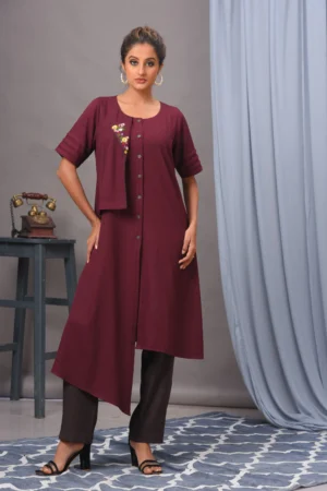 Wine moss crepe asymmetric tunic by Vivek Kumar from Golden Muslin, featuring hand embellishments and pleats, paired with coffee pants.