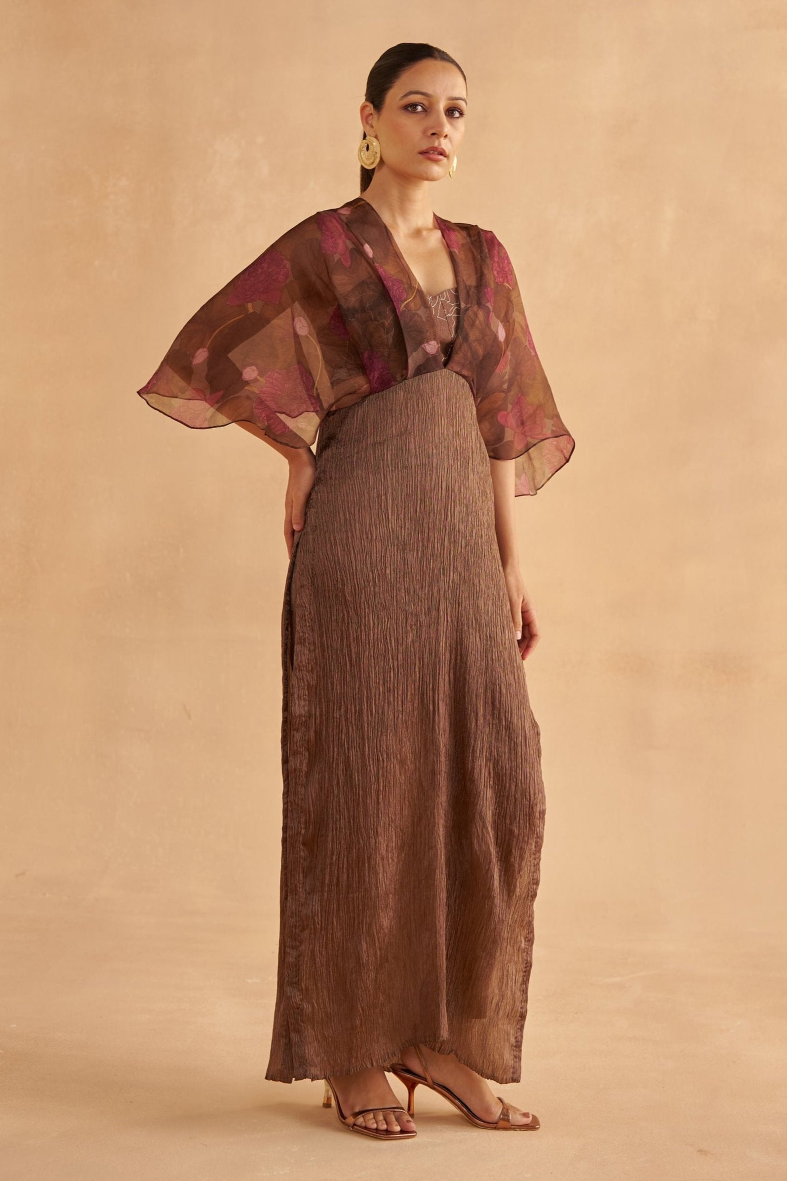 Golden Muslin walnut brown crushed silk dress with printed organza overlay and voluminous sleeves, paired with deep brown crushed silk tailored pants and a dark brown sweetheart-neck cropped blouse with Zardozi chintz embroidery.