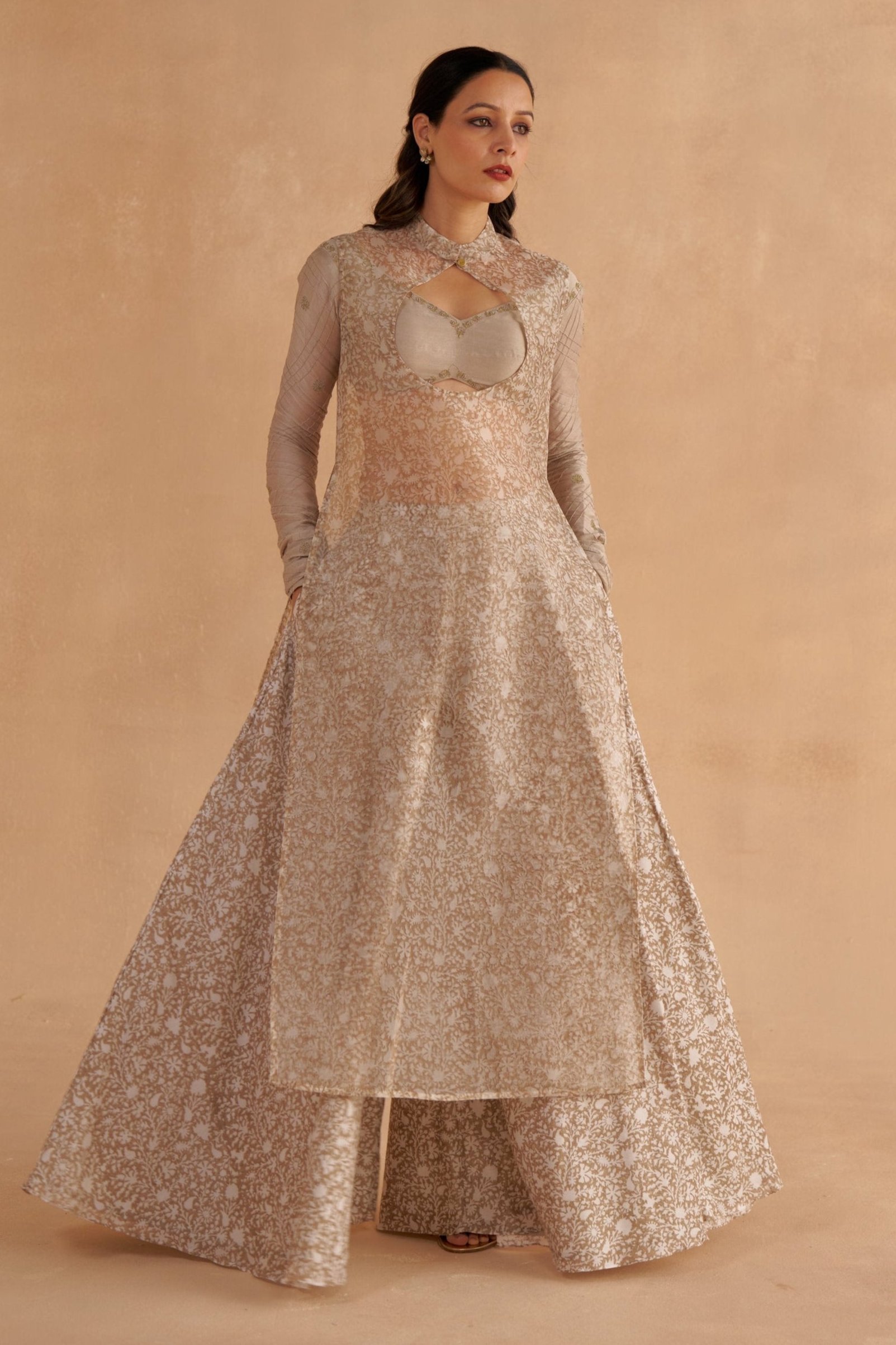 Golden Muslin warm grey Chanderi silk bustier blouse with Zardozi-embroidered sleeves, sleeveless block-printed organza kurta with keyhole neckline, and block-printed Chanderi Sharara pants.