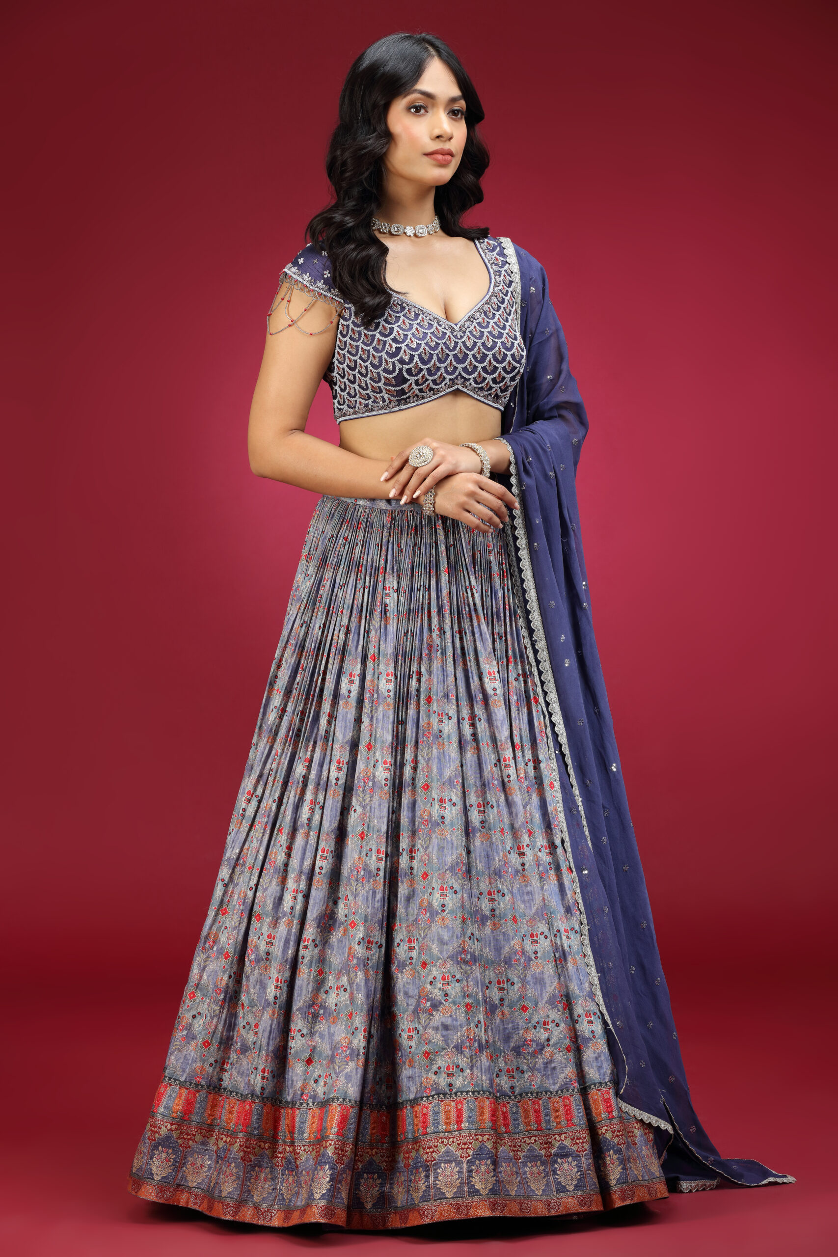 Golden Muslin dull blue crepe embroidered lehenga set with cap-sleeved embroidered blouse