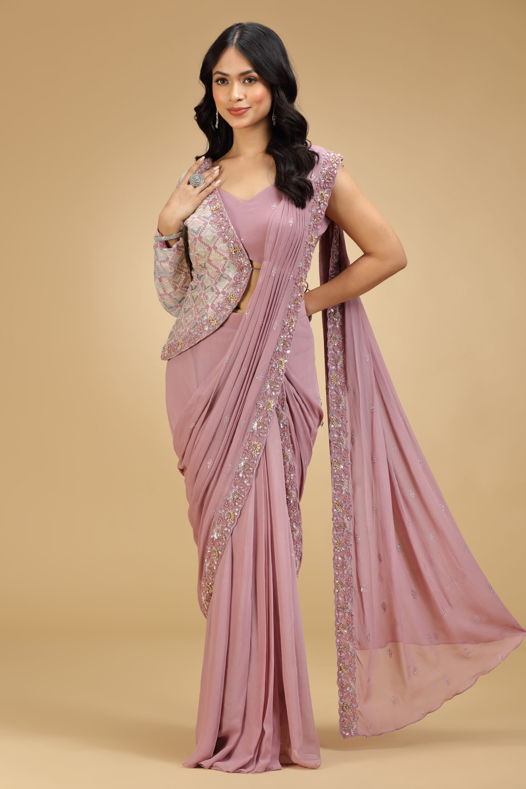 Golden Muslin dusty pink georgette pre-draped saree with butti embroidered blouse and one-sided embroidered jacket