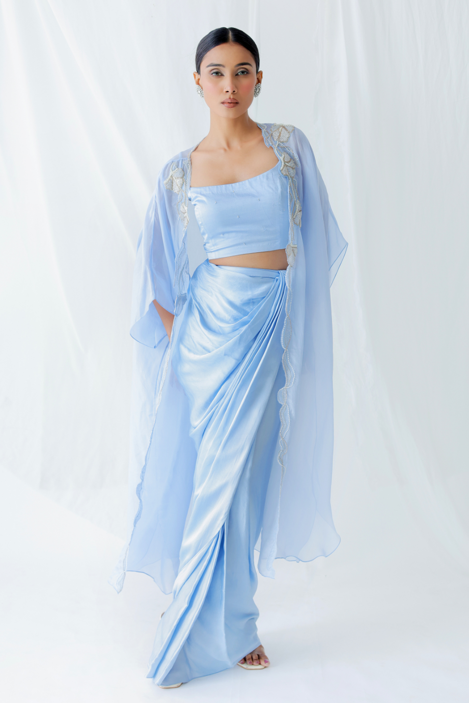 Powder blue modal silk three-piece ensemble by Golden Muslin featuring an embroidered front-open shoulder cape