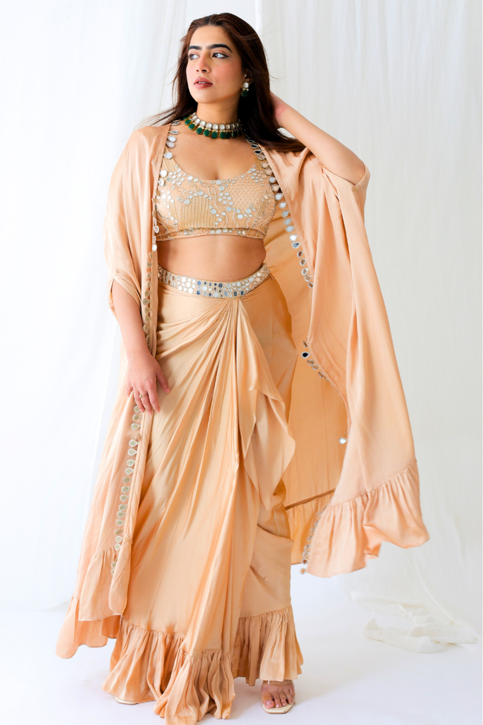 Champagne modal silk embroidered cape with draped skirt by Golden Muslin