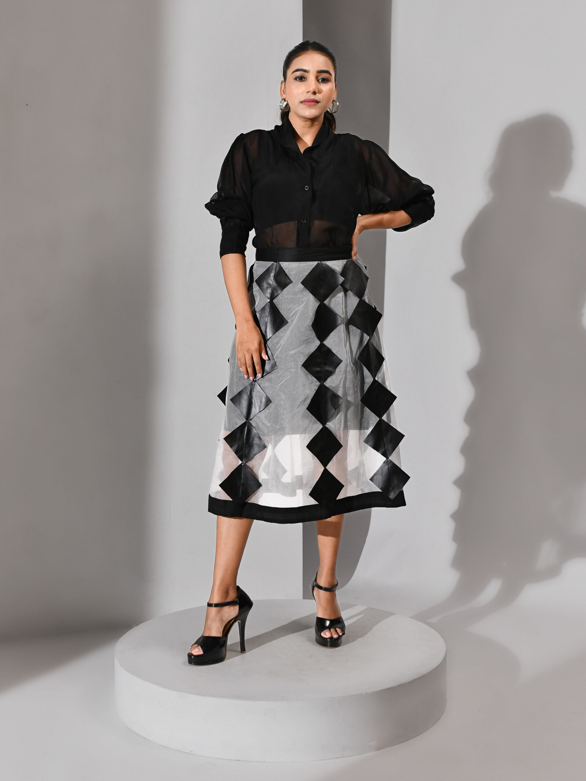 Black and white three-piece co-ord skirt set with translucent organza shirt