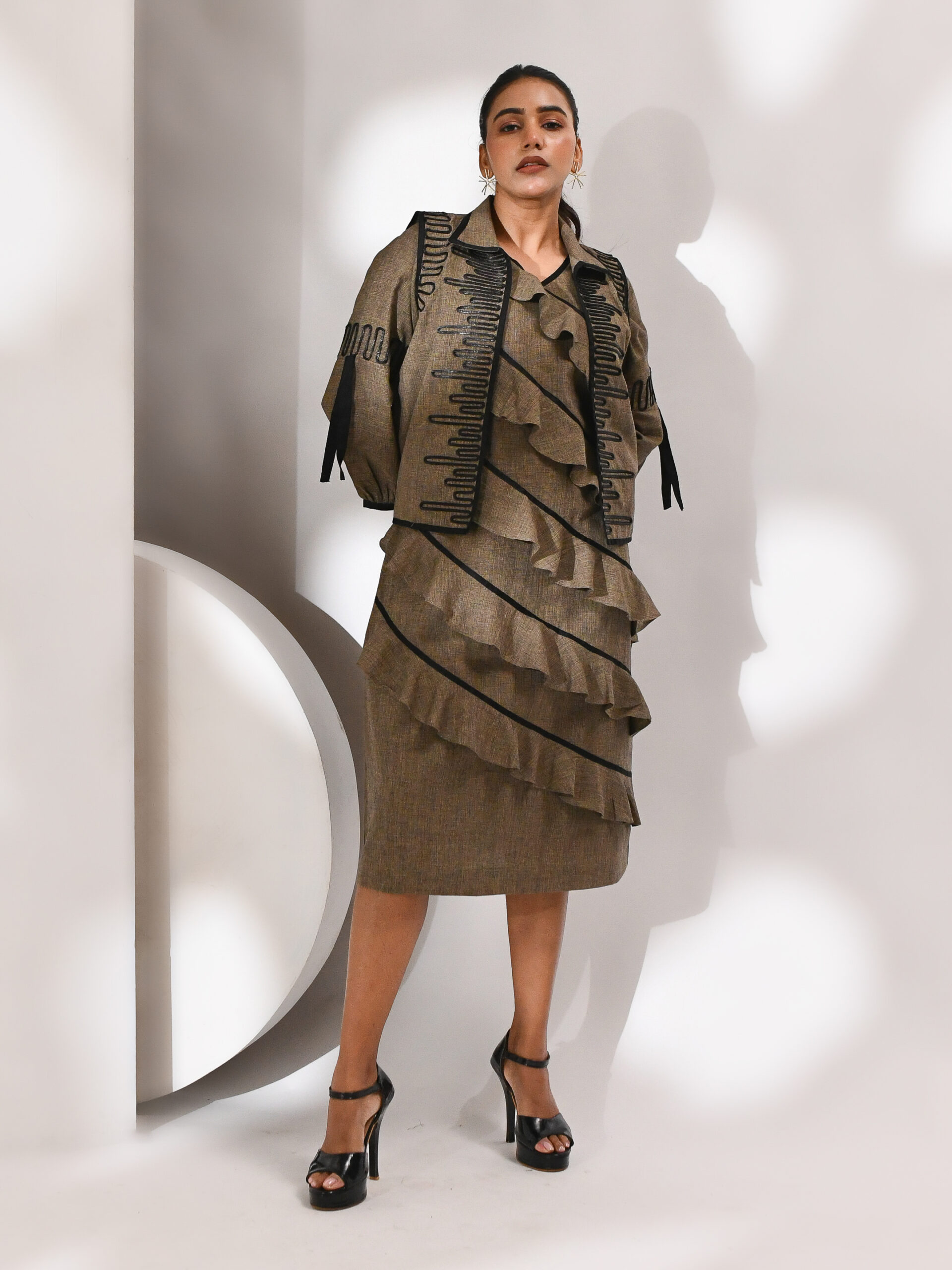 Brown dress with circular cut details