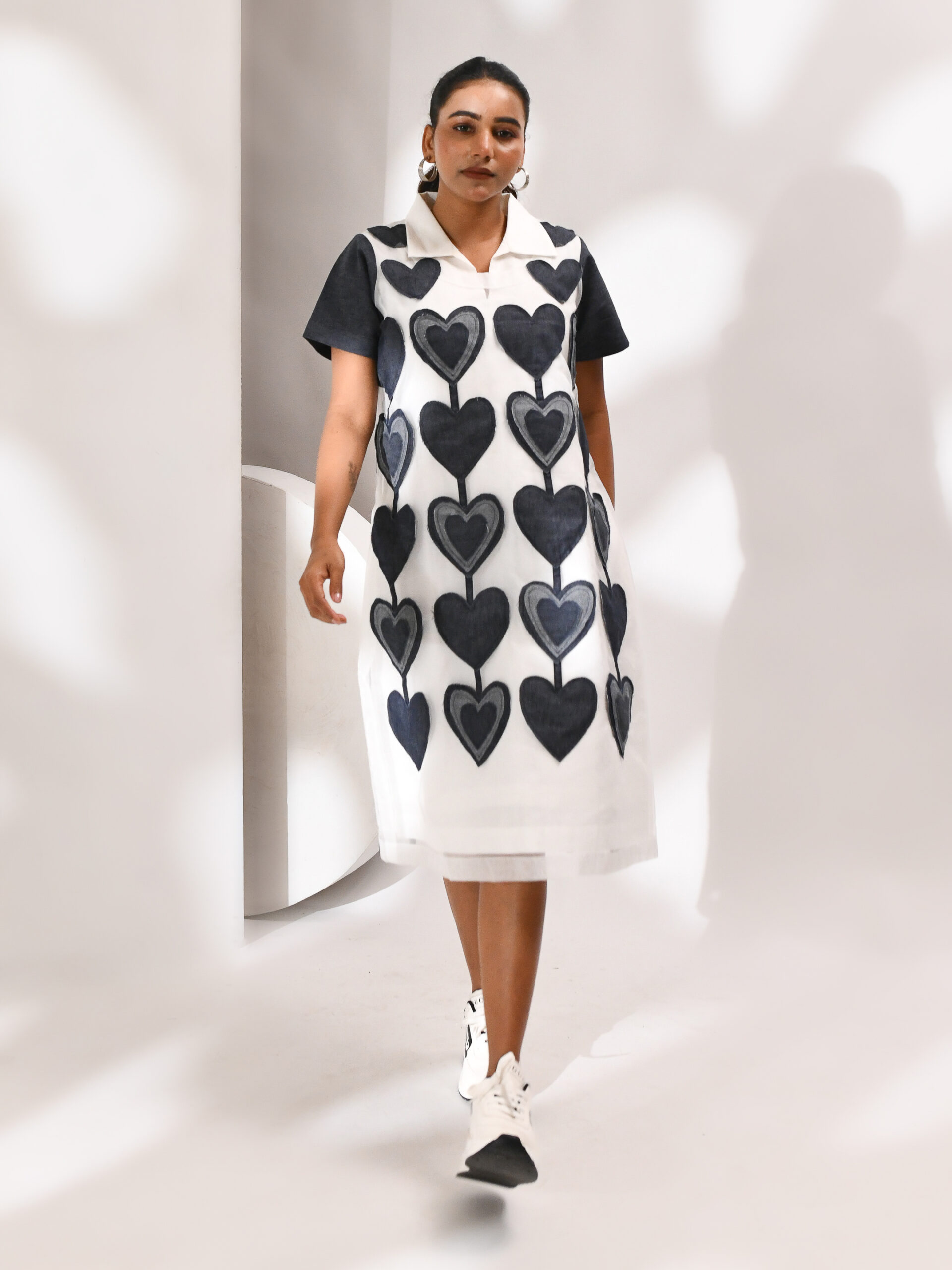 White organza dress with heart-shaped patches on the front and striped back