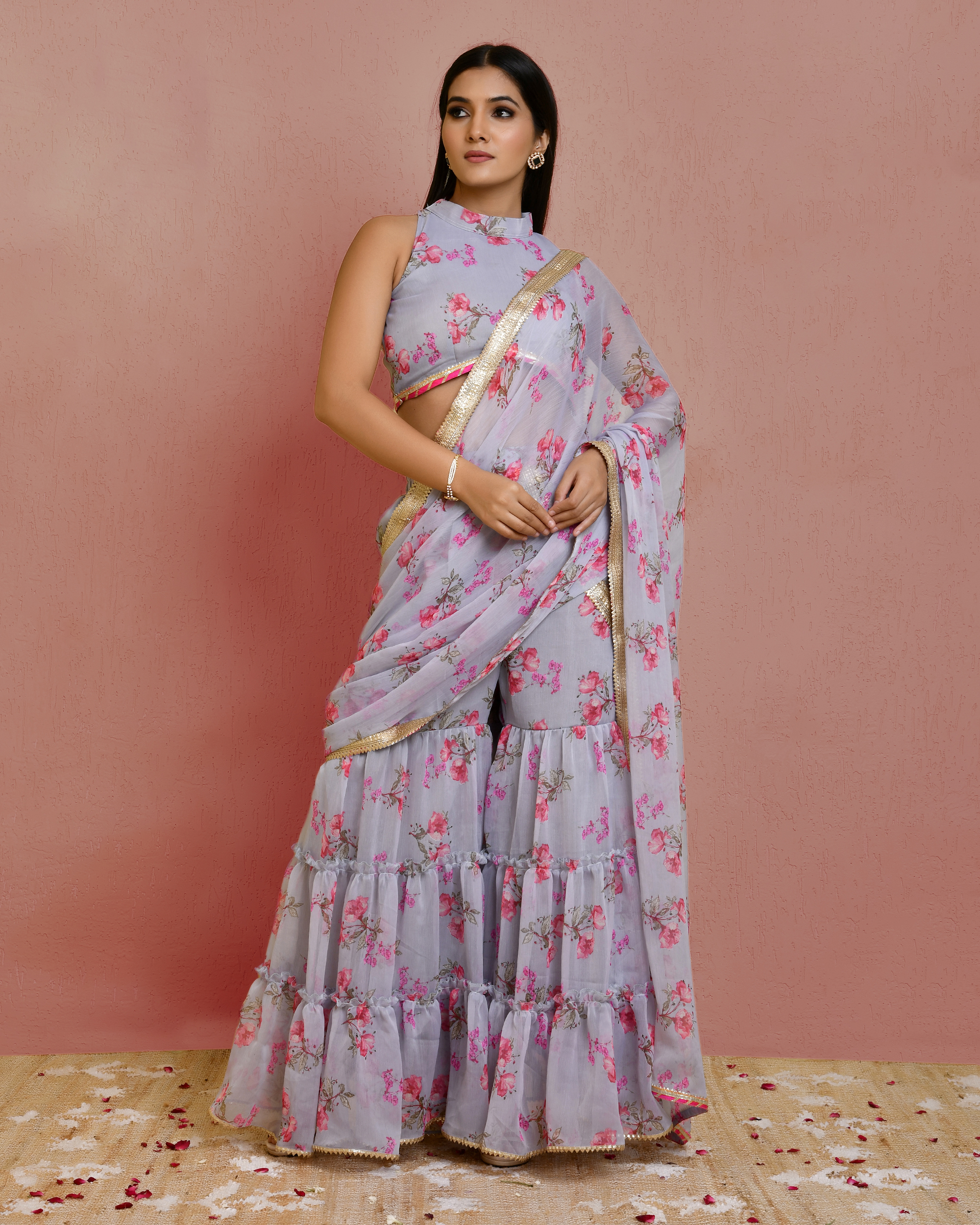Grey pre-draped floral printed chiffon sharara saree with gota patti lace detailing and high-neck blouse finished with delicate lace accents in Golden Muslin by Priyanka Rathore