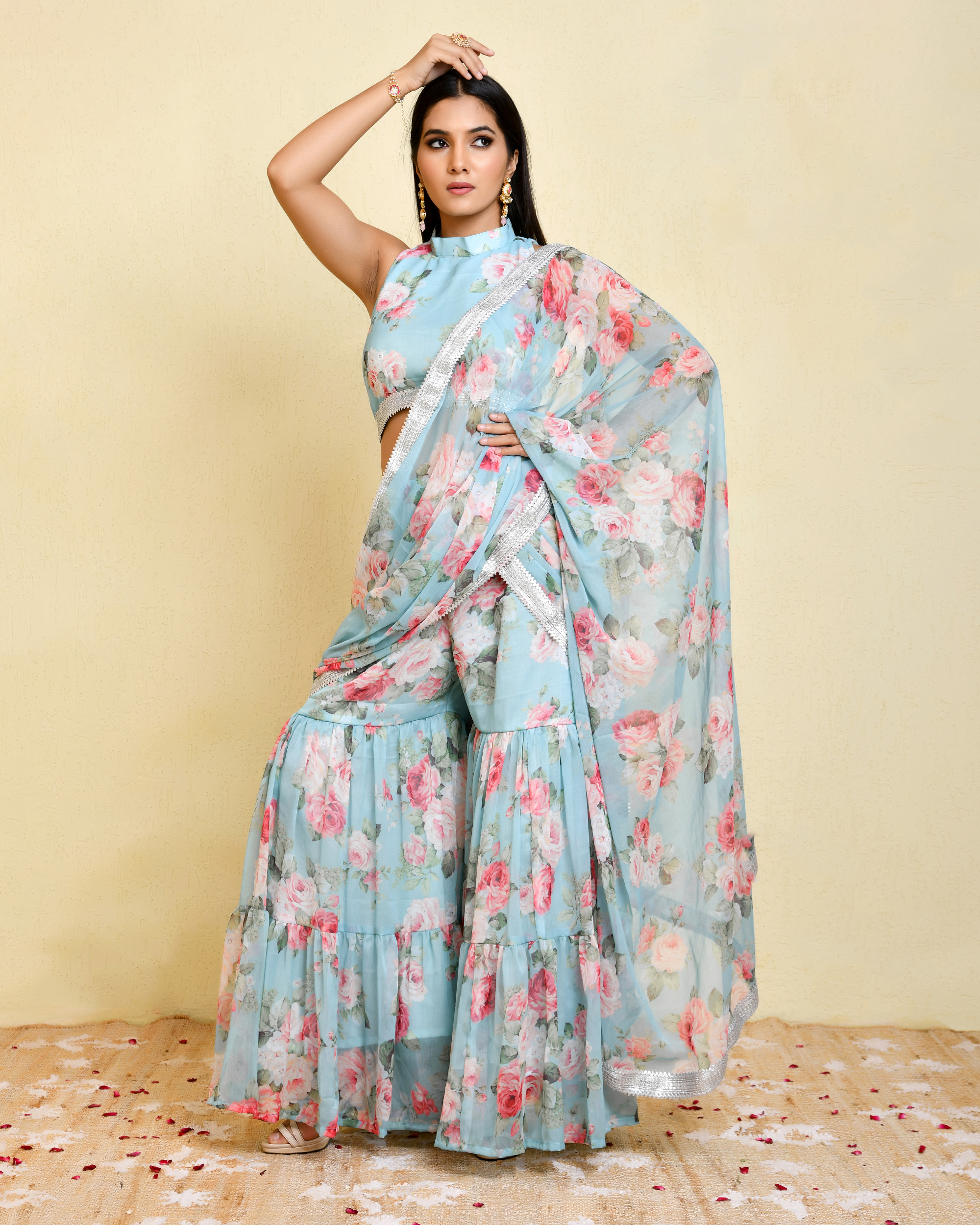 Blue pre-draped floral printed georgette sharara saree with lace detailing and high-neck sleeveless blouse in Golden Muslin by Priyanka Rathore