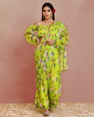 Green pre-draped floral printed georgette pant saree with lace border detailing and smocked blouse with balloon sleeves in Golden Muslin by Priyanka Rathore