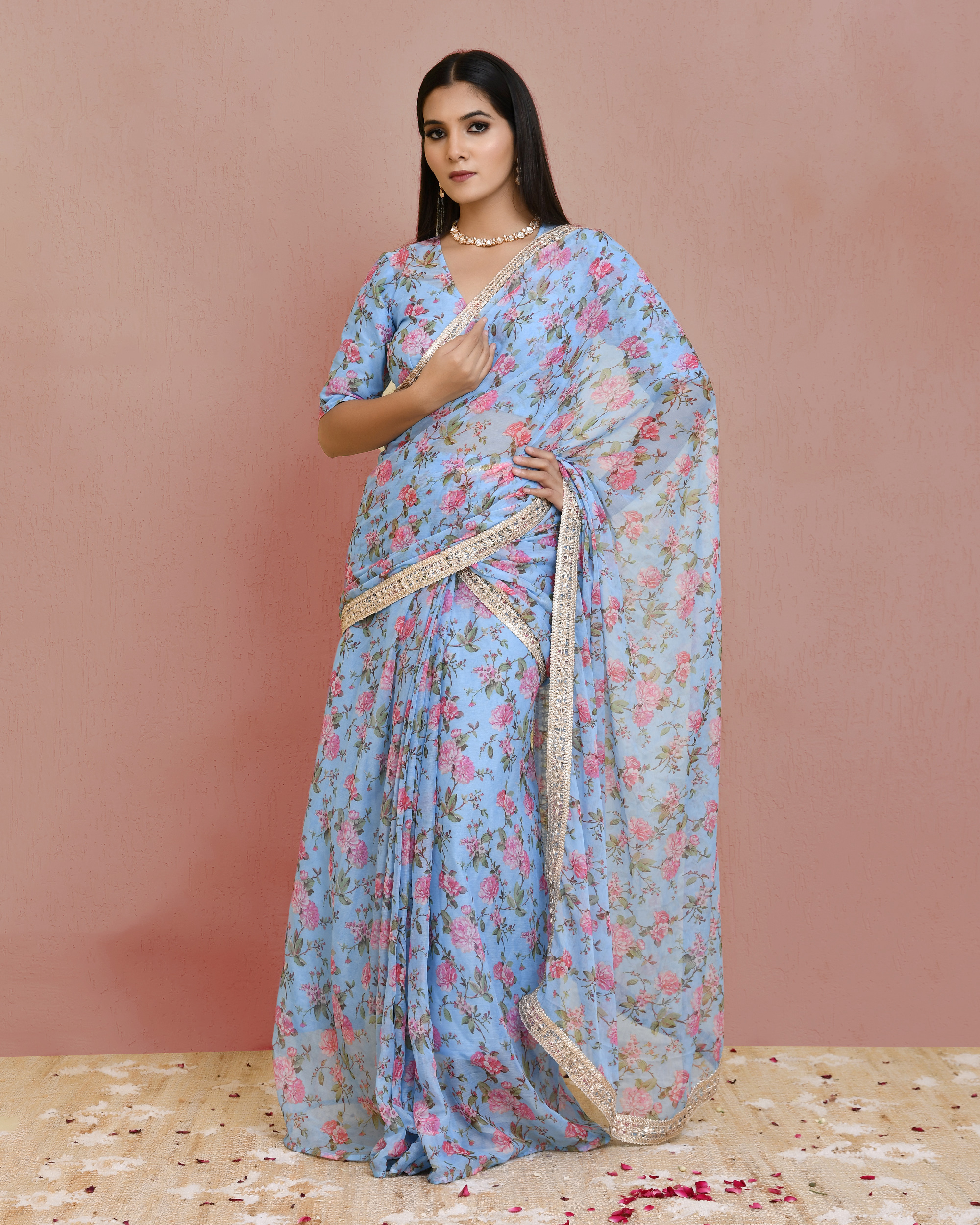 Blue pre-draped floral printed georgette saree with lace border detailing and short-sleeve wrap choli blouse in Golden Muslin by Priyanka Rathore