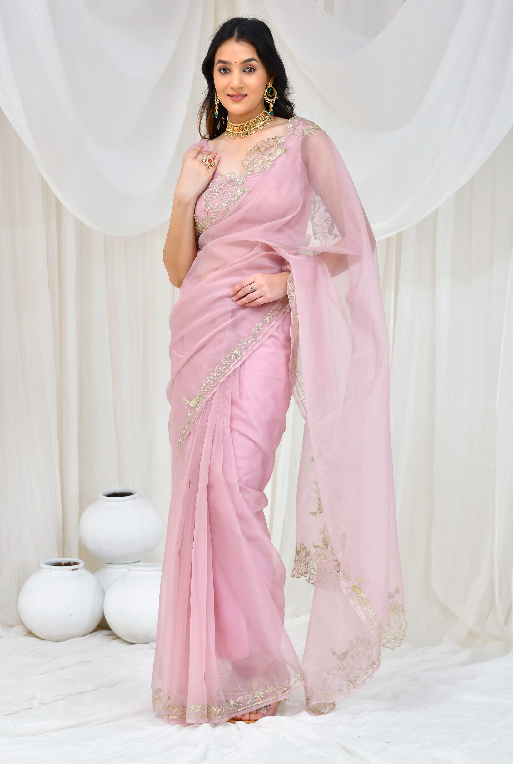 Golden Muslin pastel pink organza saree with intricate aari embroidery by Priyanka Rathore