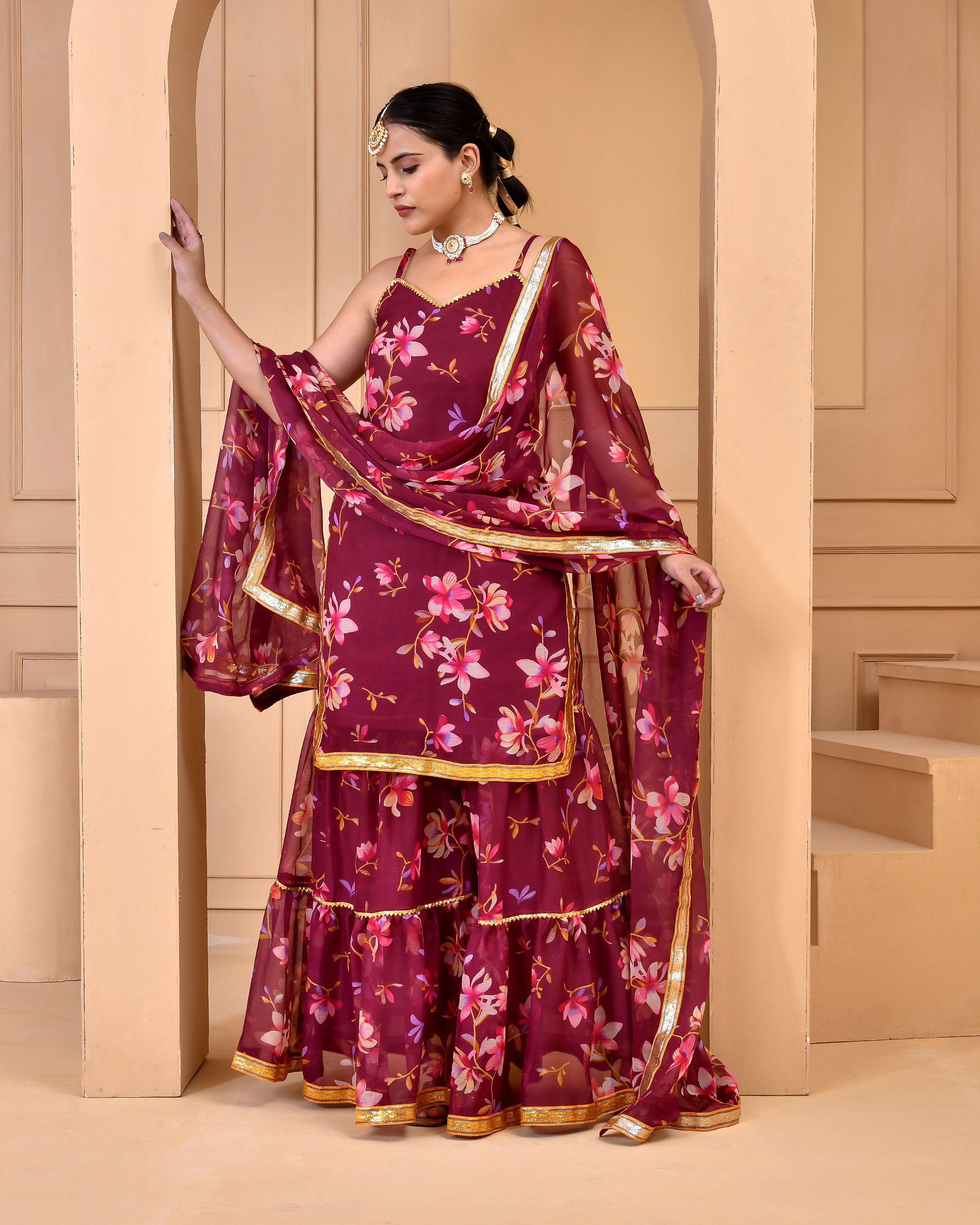 Mauve chiffon floral printed sharara set with short kurta featuring noodle straps, gota detailing, matching sharara and coordinated dupatta finished with gota accents in Golden Muslin by Priyanka Rathore