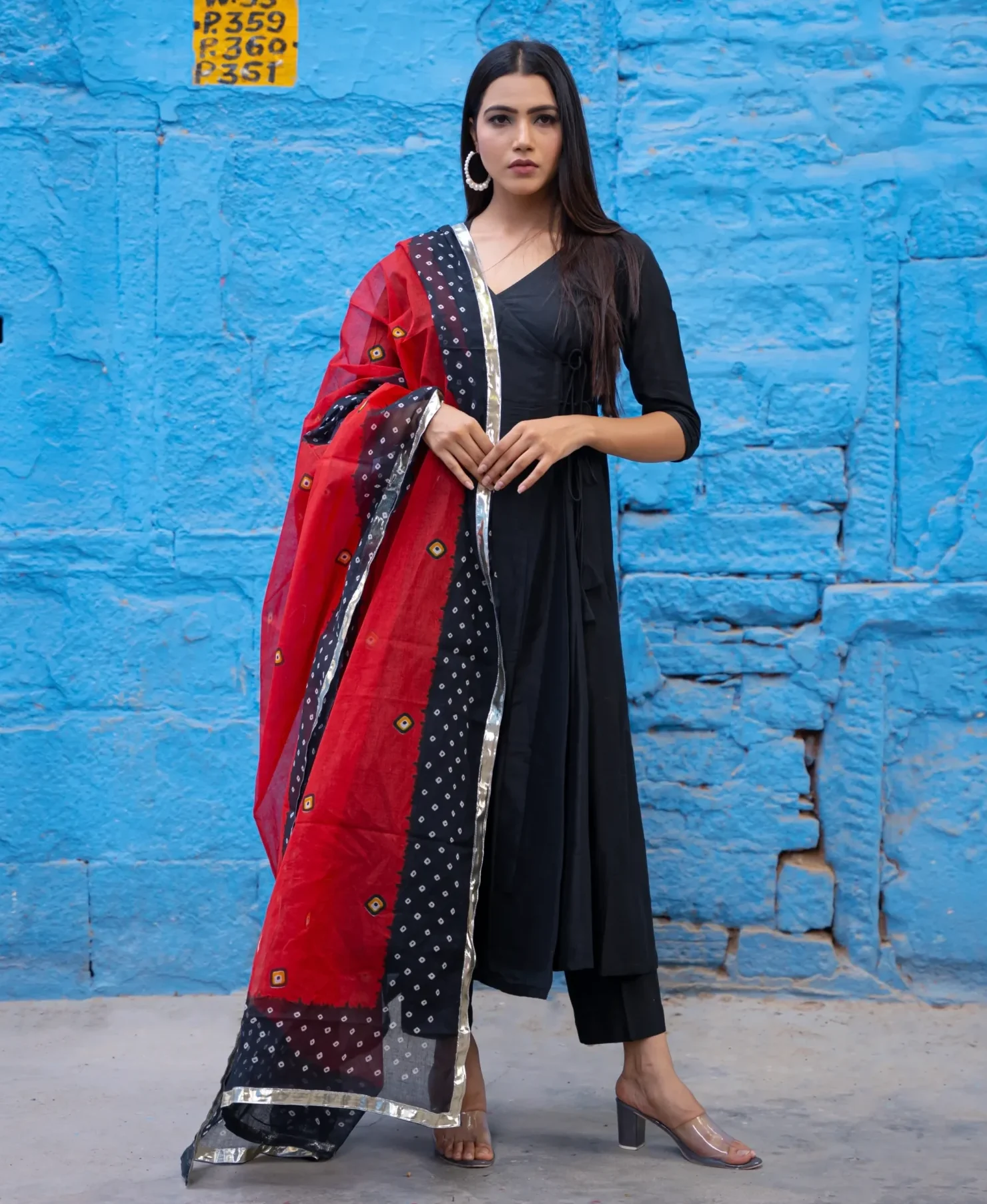 Black Angrakha suit set with wrap-style kurta and straight-fit pants, offering timeless elegance, effortless comfort, and refined festive appeal, Golden Muslin by Priyanka Rathore.