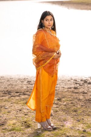 Mustard Jam cotton silk suit set with aari embroidered kurta, pants and dupatta from Golden Muslin by Priyanka Rathore