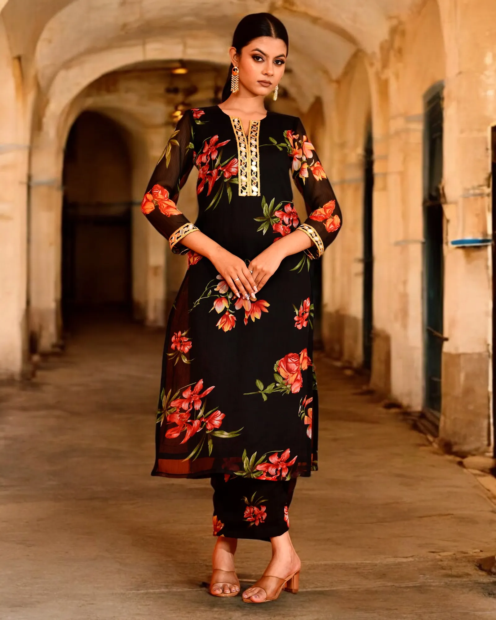 Black chiffon kurta pant set by Golden Muslin by Priyanka Rathore featuring graceful floral prints and a soft fluid drape for modern ethnic elegance