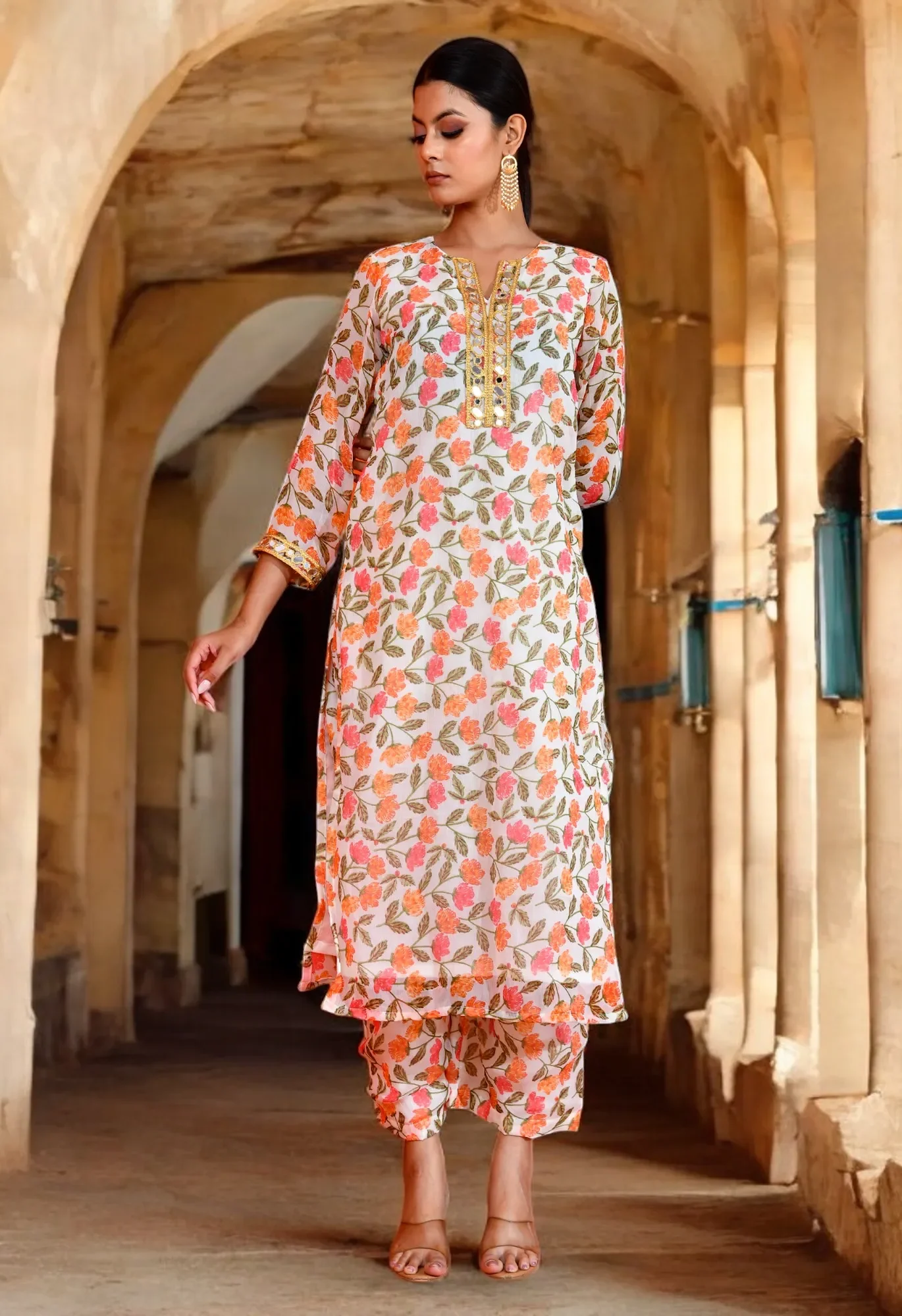 Soft off-white chiffon kurta set with delicate floral prints and an airy silhouette from Golden Muslin by Priyanka Rathore, ideal for elegant ethnic styling.
