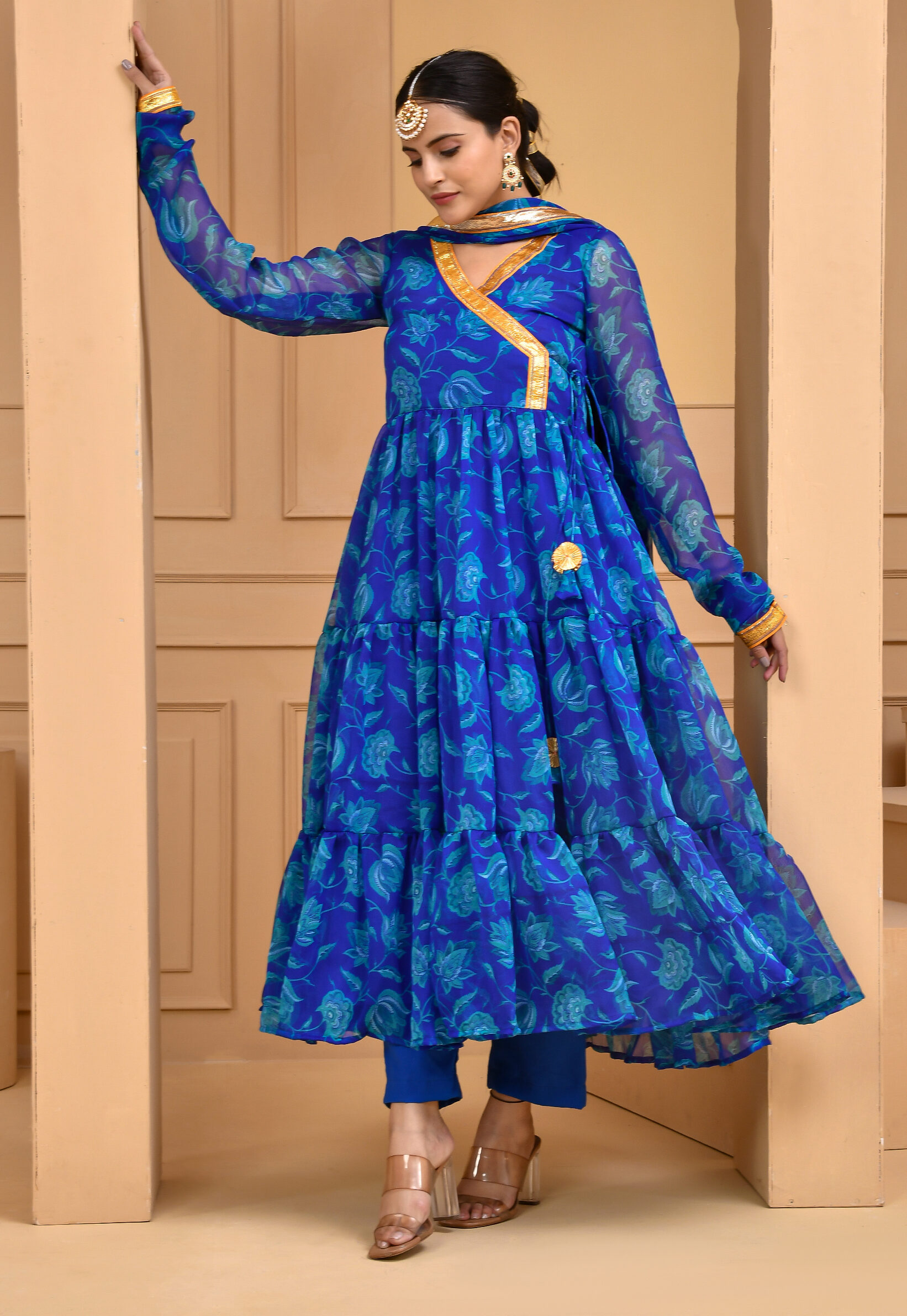 Blue chiffon floral print floor-length Anarkali set with angrakha silhouette, subtle gota detailing, solid blue pants and matching floral dupatta with gota accents in Golden Muslin by Priyanka Rathore