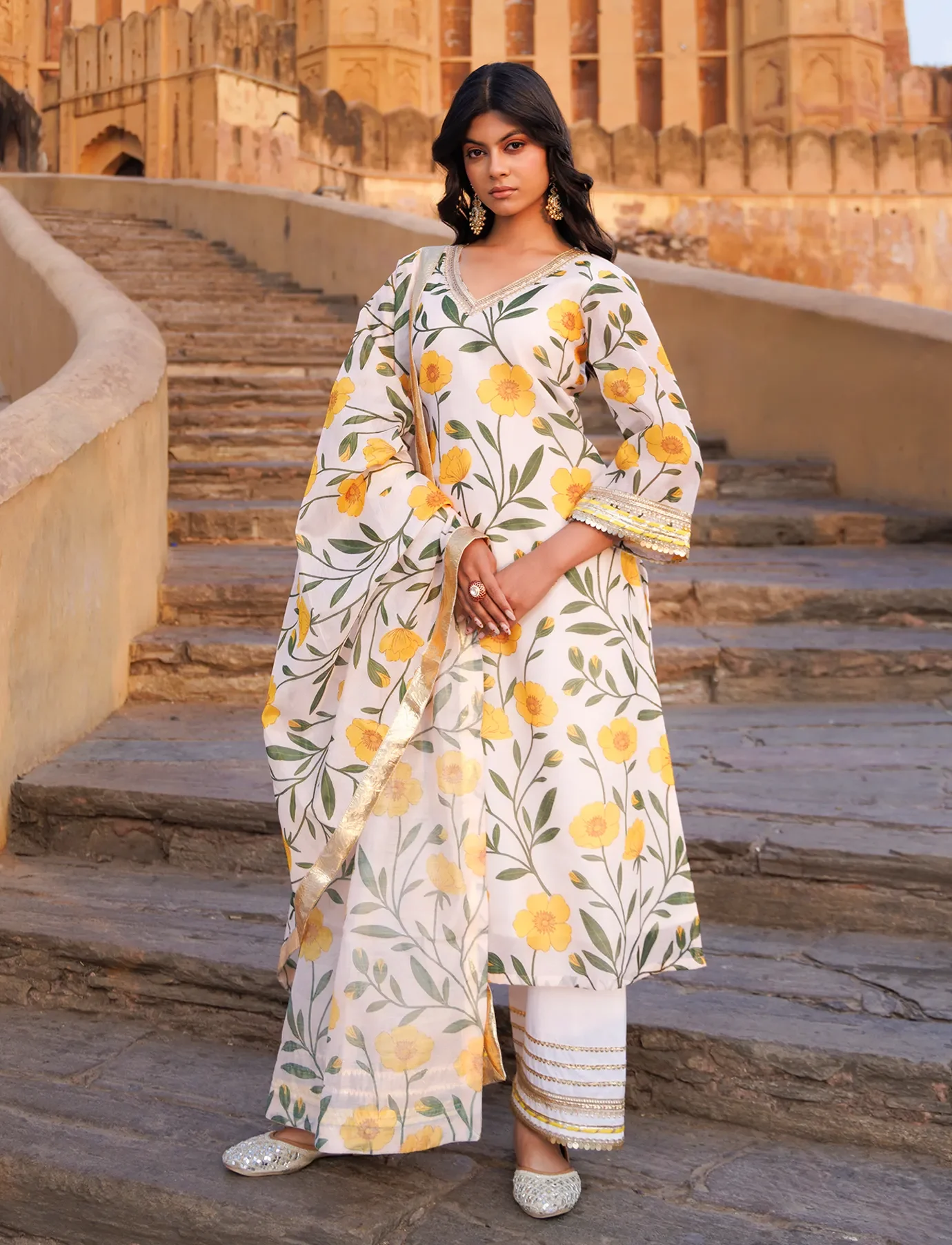 Off-white Chanderi kurta set with hand floral prints, gota and sequin detailing from Golden Muslin by Priyanka Rathore