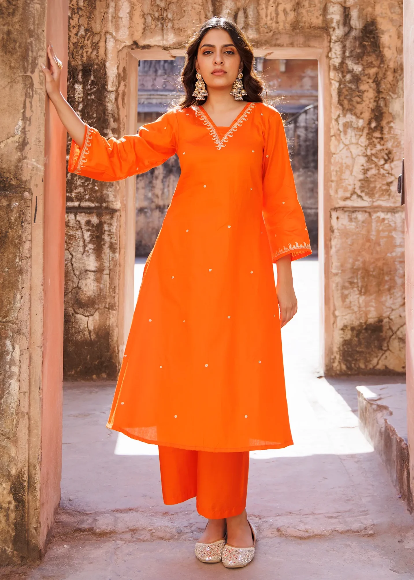 Orange cotton silk kurta set with delicate aari embroidery and soft sheen from Golden Muslin by Priyanka Rathore