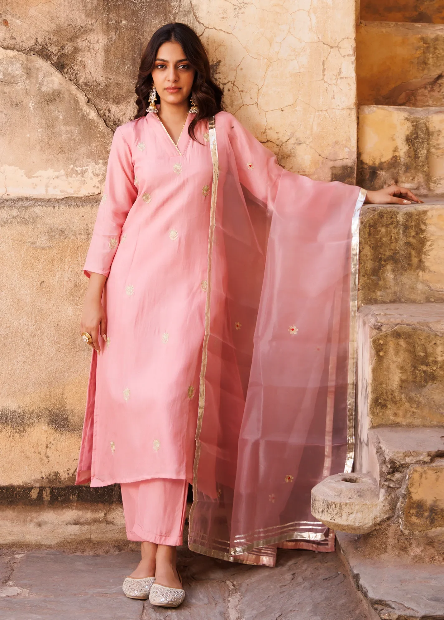 Blush pink Uppada silk kurta set with aari embroidered floral motifs and lustrous finish from Golden Muslin by Priyanka Rathore