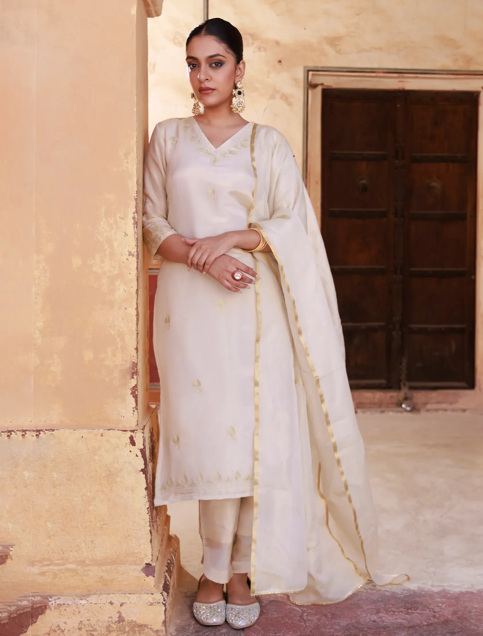 Ivory gold tissue kurta set with delicate aari embroidery and luminous sheen from Golden Muslin by Priyanka Rathore